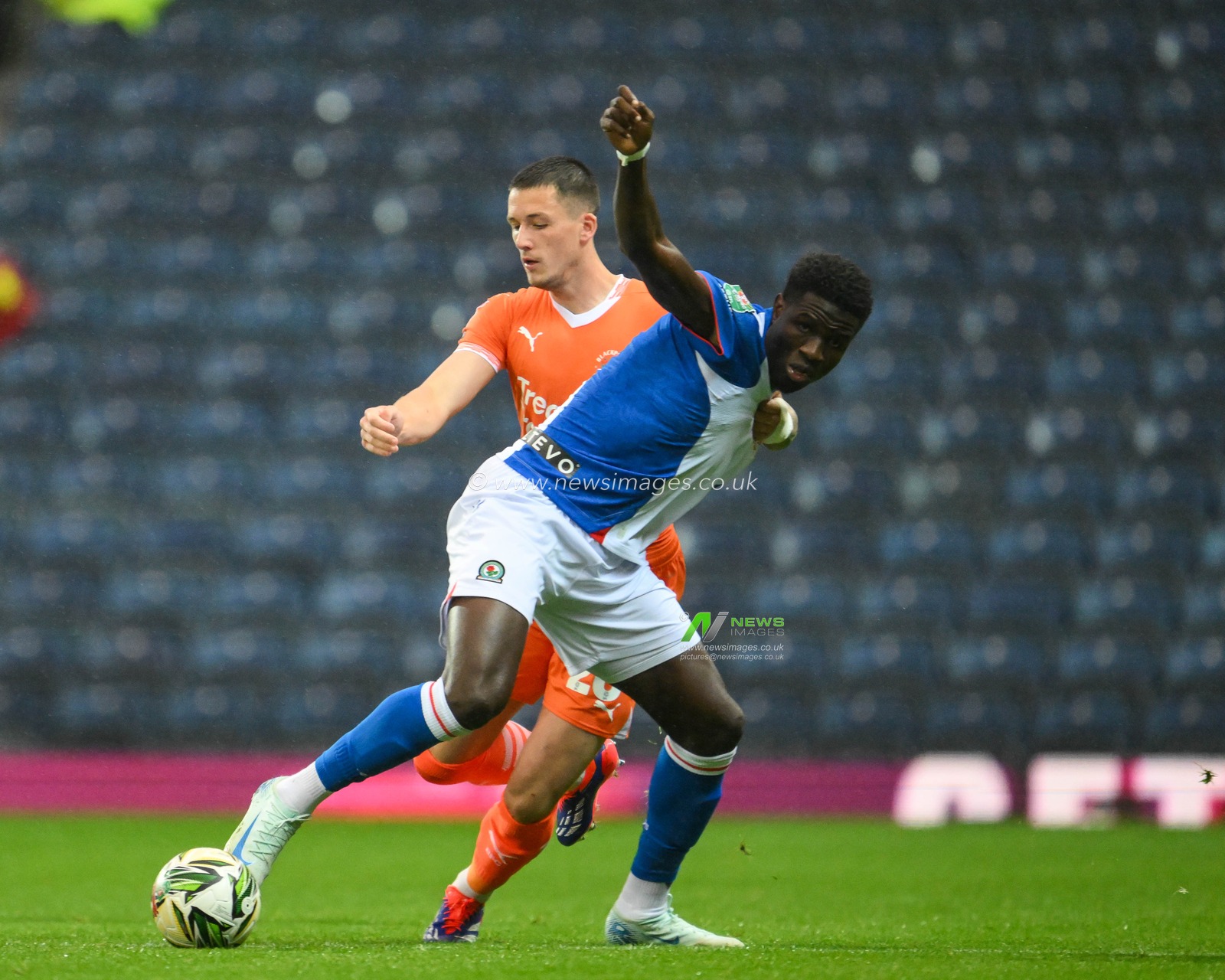Oliver Casey of Blackpool and Makhtar Gueye of Blackburn Rovers battle for the ball during the Carabao Cup match Blackburn Rovers vs Blackpool at Ewood Park, Blackburn, United Kingdom, 27th August 2024

(Photo by Craig Thomas/News Images)