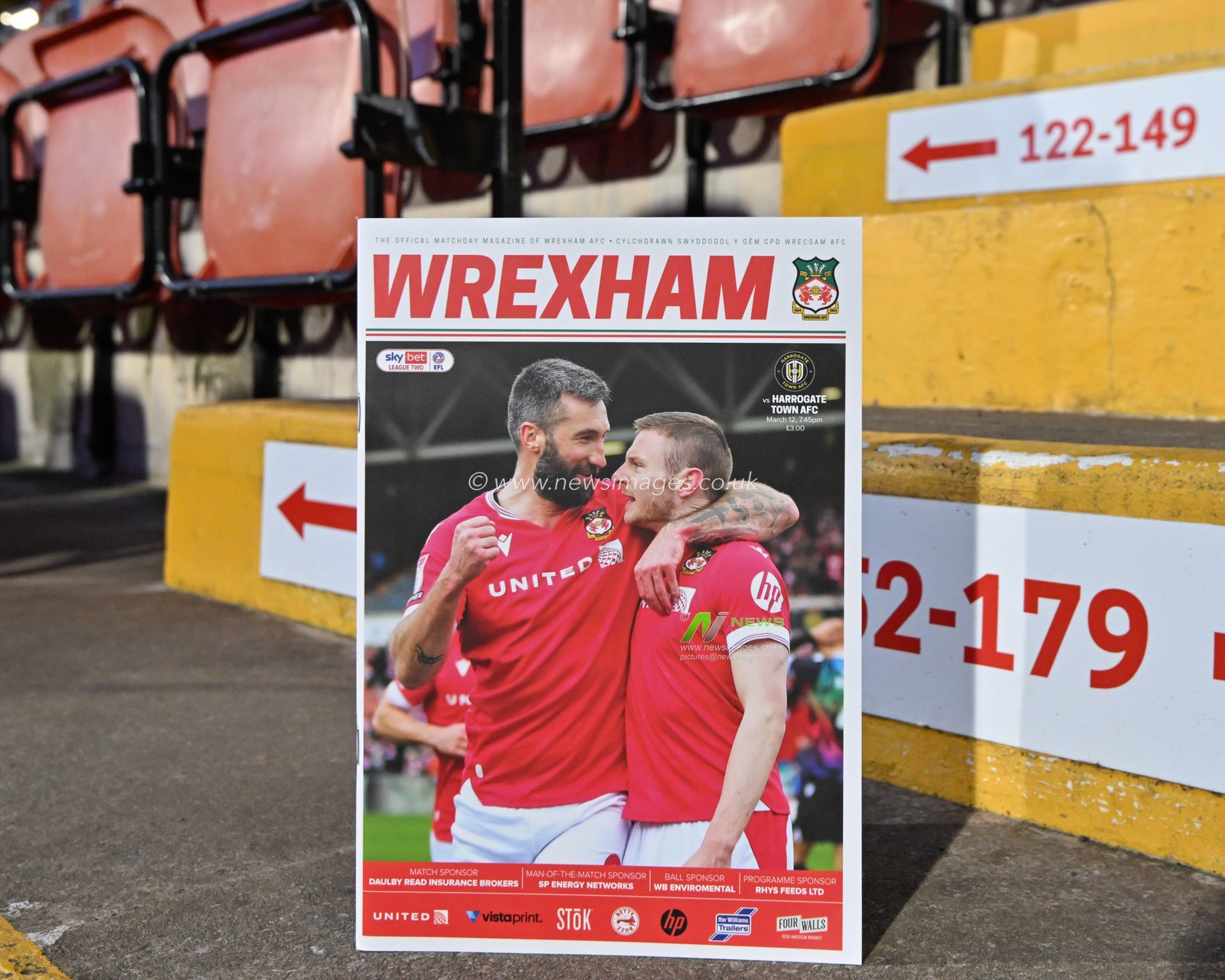 Ollie Palmer of Wrexham and Paul Mullin of Wrexham on the cover of the match day program in the stands of the SToK Cae Ras ahead of the match, during the Sky Bet League 2 match Wrexham vs Harrogate Town at SToK Cae Ras, Wrexham, United Kingdom, 12th March 2024

(Photo by Cody Froggatt/News Images)
