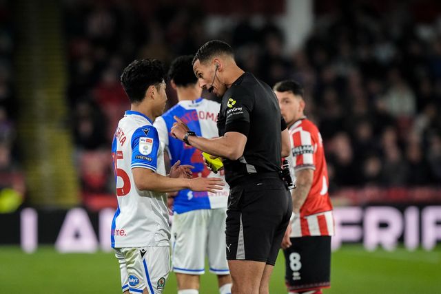 Referee Farai Hallam gives a yellow card to  Ryoya Morishita of Blackburn Rovers for dissent during the Sky Bet Championship match Sheffield United vs Blackburn Rovers at Bramall Lane, Sheffield, United Kingdom on 22 April 2026

(Photo by Maynard Manyowa/News Images)