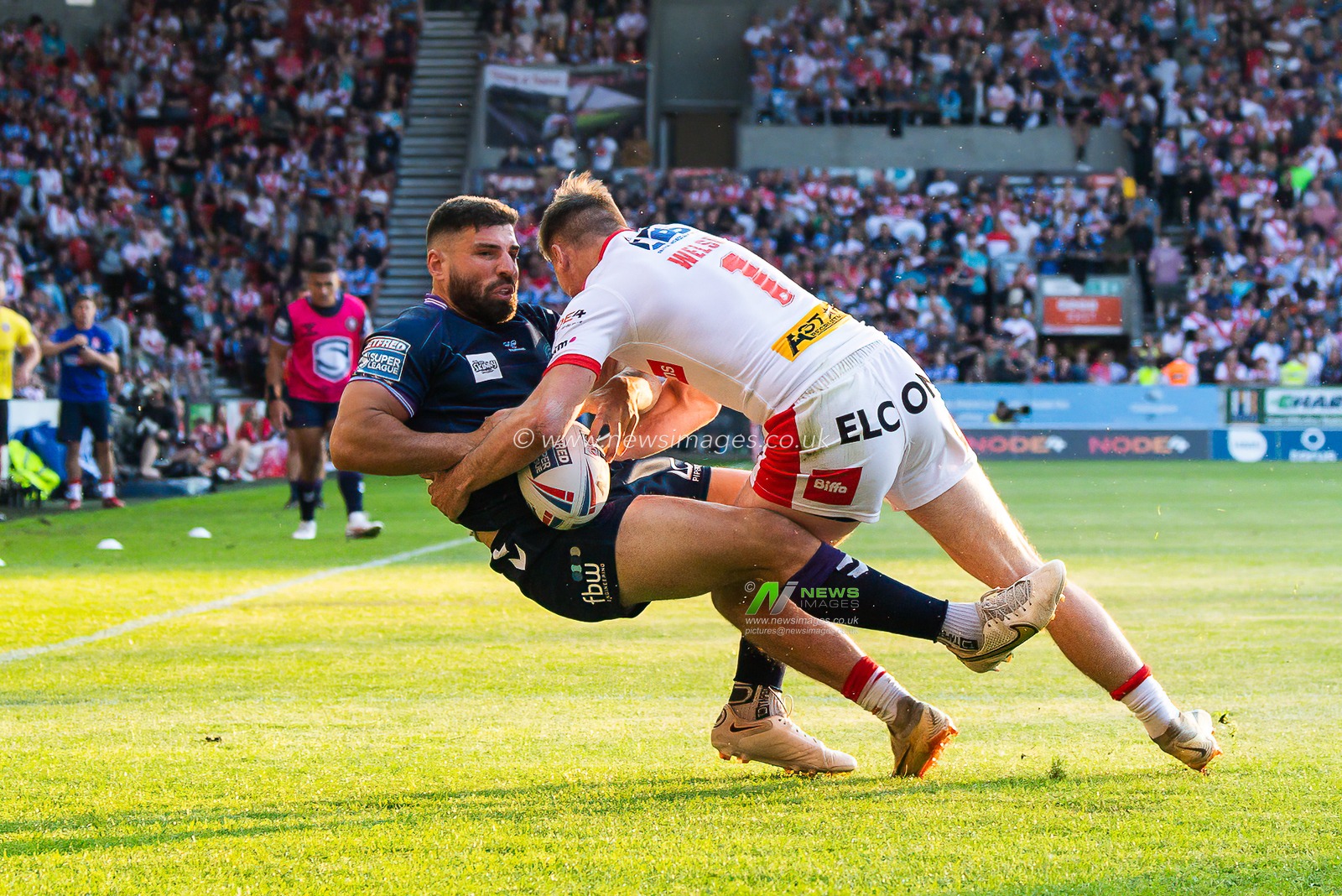 Abbas Miski #23 of Wigan Warriors is tackled by Jack Welsby #1 of St Helens  during the Betfred Super League Round 15 match St Helens vs Wigan Warriors at Totally Wicked Stadium, St Helens, United Kingdom, 9th June 2023

(Photo by Craig Thomas/News Images)