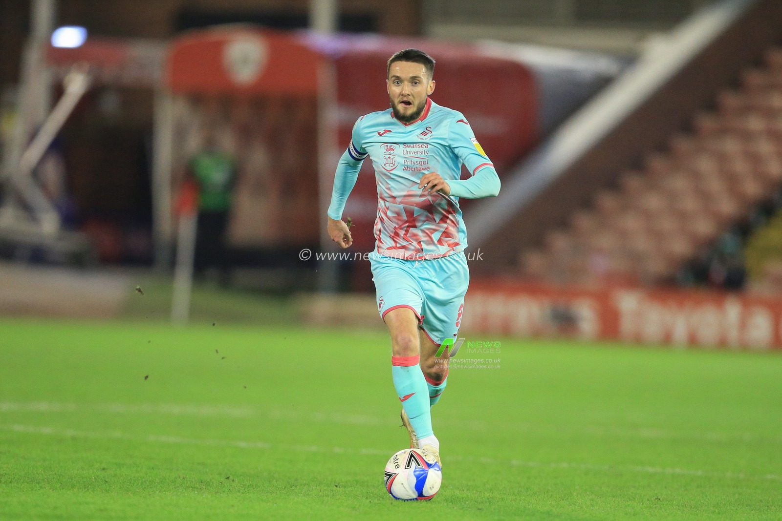 Matt Grimes #8 of Swansea City breaks