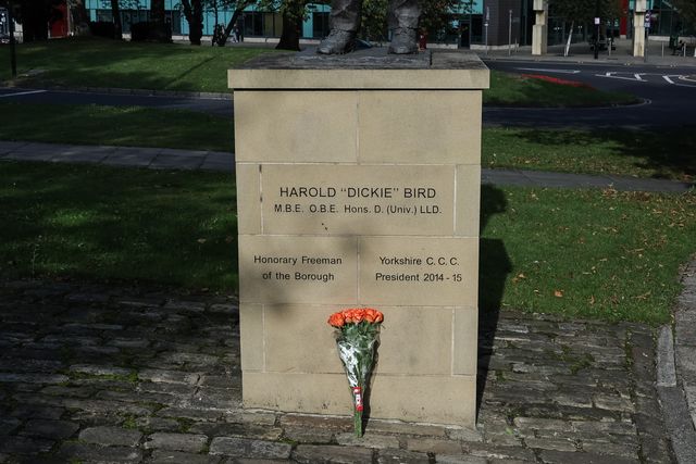 Flowers are laid at The Harold 'Dickie' Bird MBE, OBE statue after his passing today at the age of 92, Barnsley, United Kingdom, 23rd September 2025

(Photo by Mark Cosgrove/News Images)