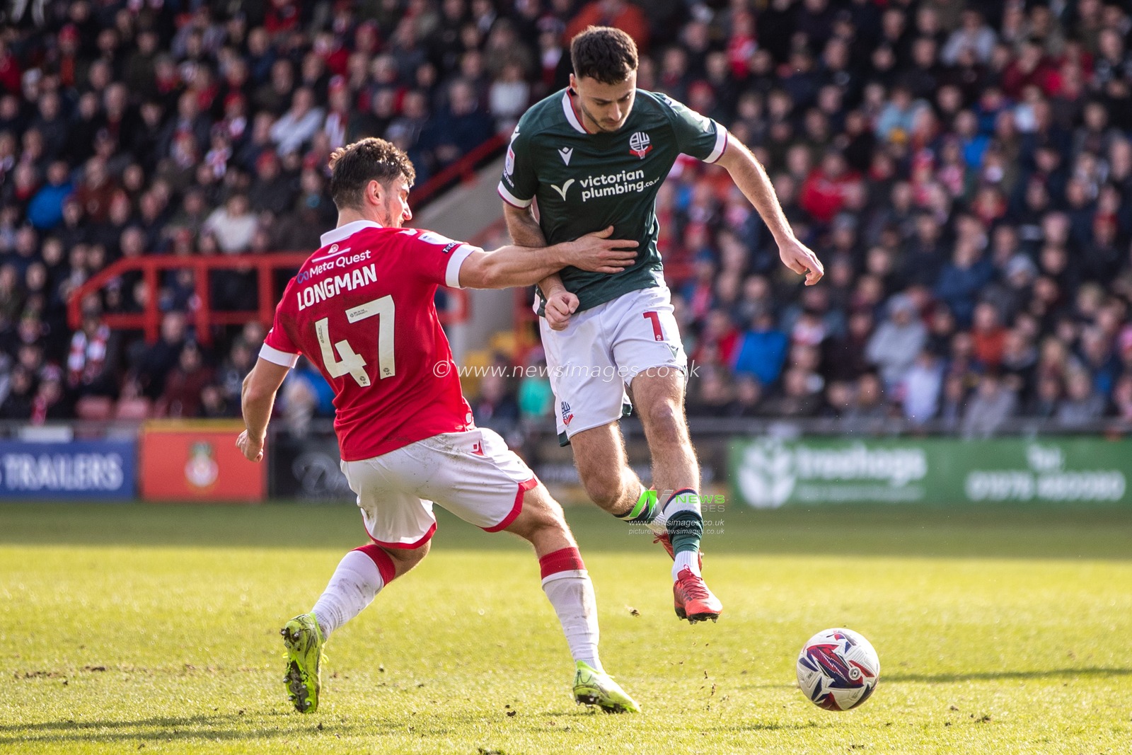 Aaron Collins of Bolton Wanderers evades Ryan Longman of Wrexham AFC during the Sky Bet League 1 match Wrexham vs Bolton Wanderers at SToK Cae Ras, Wrexham, United Kingdom, 1st March 2025

(Photo by Nik Mesney/News Images)