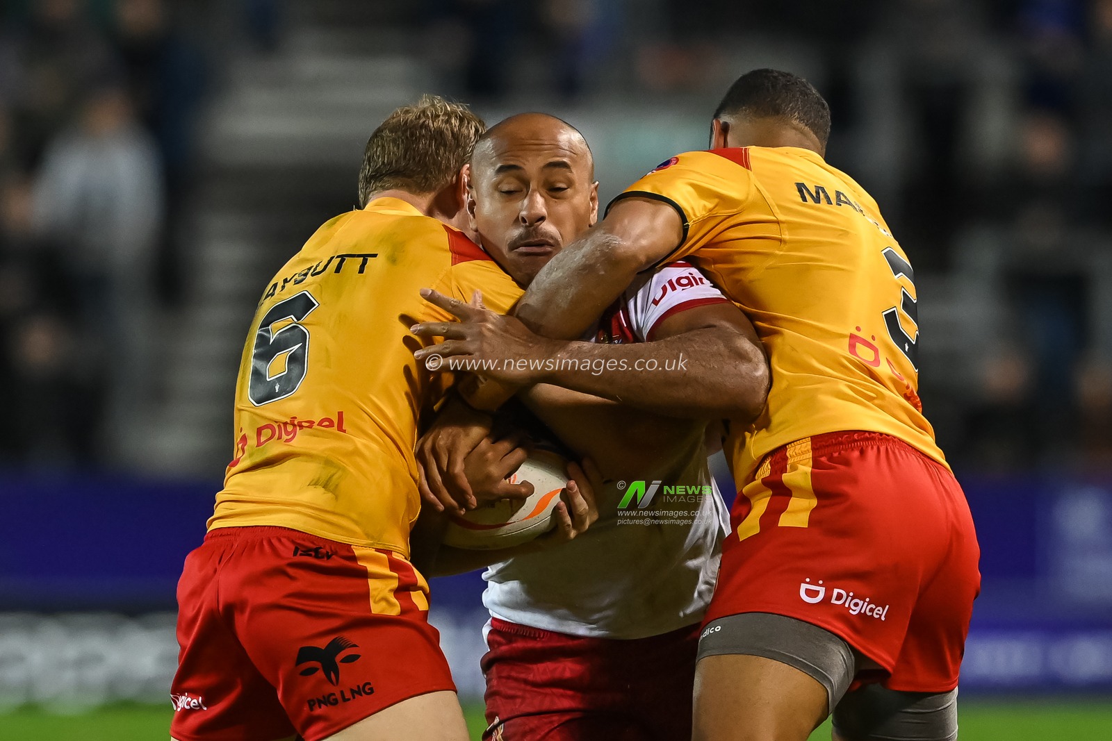 Felise Kaufusi of Tonga is tackled by Wellington Albert and Nene Macdonald of Papua New Guinea during the Rugby League World Cup 2021 match Tonga vs Papua New Guinea at Totally Wicked Stadium, St Helens, United Kingdom, 18th October 2022

(Photo by Craig Thomas/News Images)