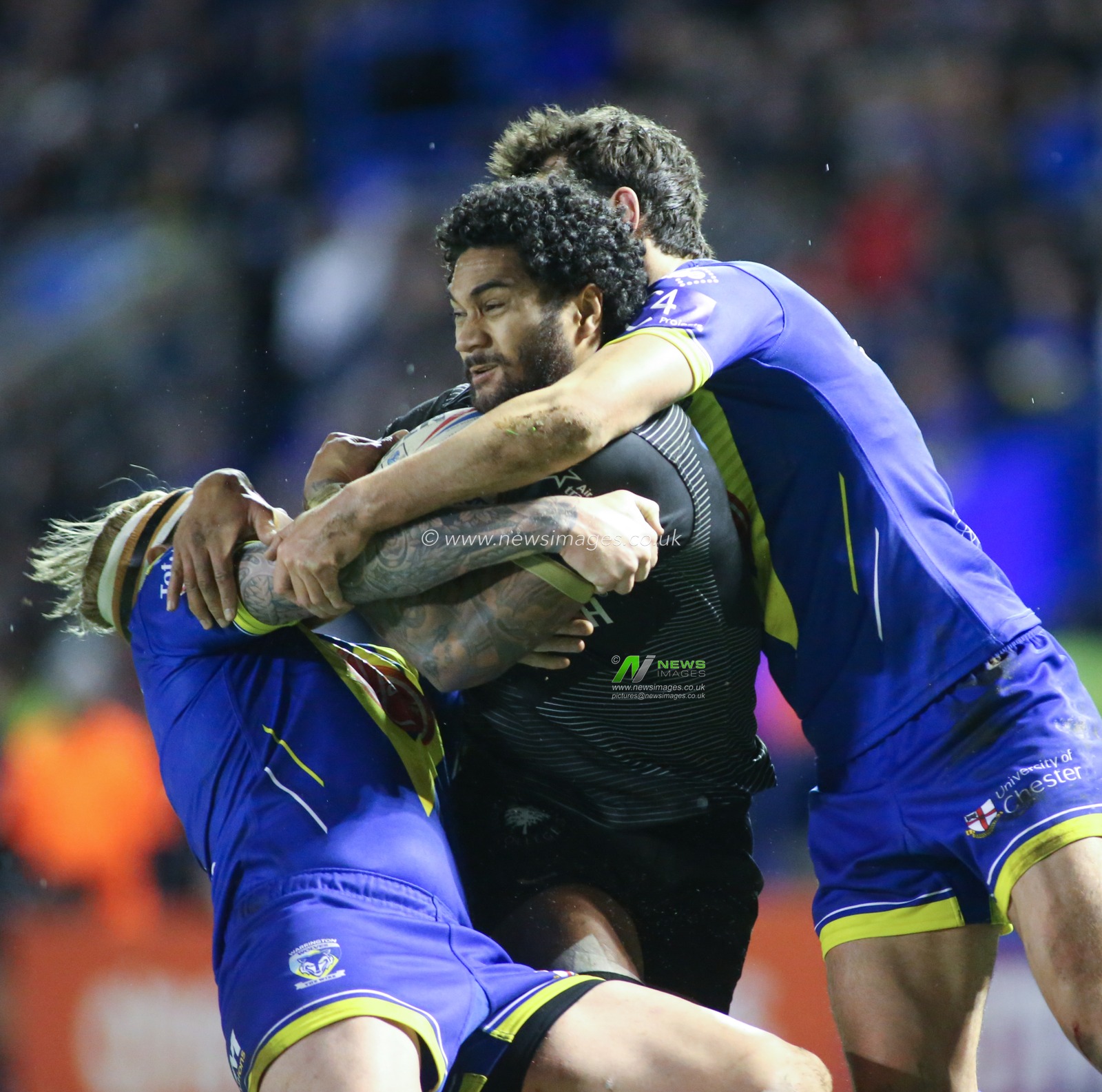 21st February 2020, Halliwell Jones Stadium, Warrington, England; Betfred Super League, Warrington Wolves v Toronto Wolfpack : Ricky Leutele of Toronto Wolfpack tackled by Blake Austin (L) and Stefan Ratchford (R) of Warrington Wolves.
