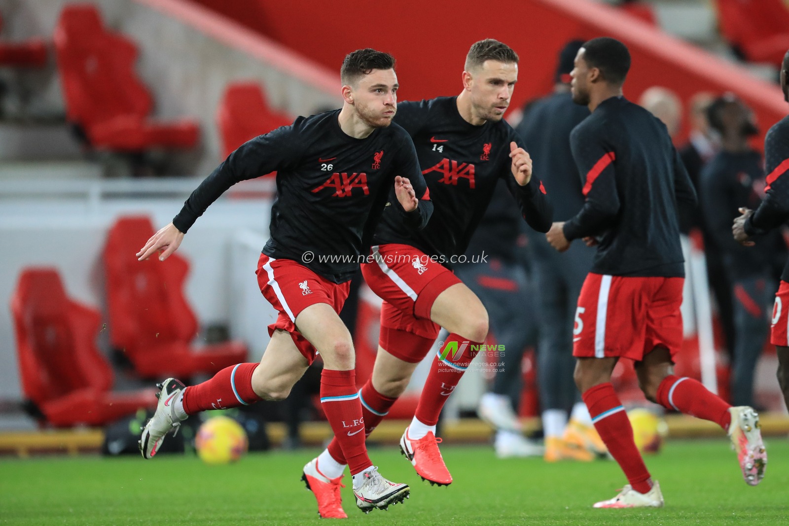 Andrew Robertson #26 of Liverpool and Jordan Henderson #14 of Liverpool during the pre-game warmup
