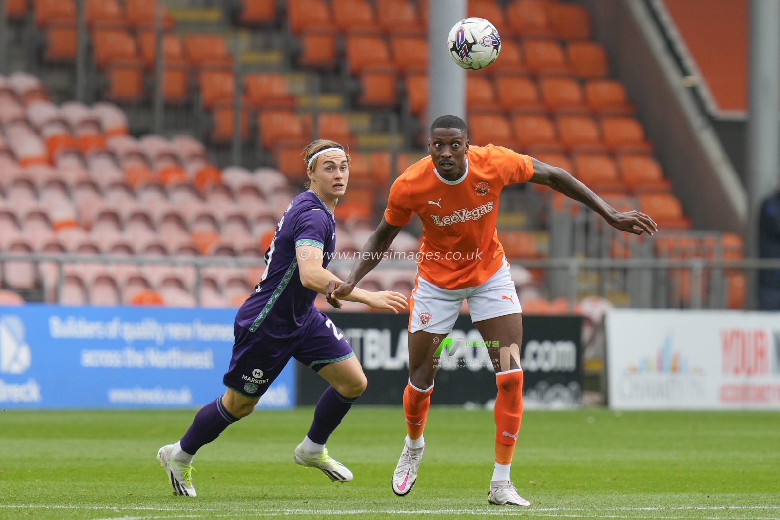 Elias Melkersen #20 of Hibernian competes for a header with Marvin Ekpiteta #21 of Blackpool during the Pre-season friendly match Blackpool vs Hibernian at Bloomfield Road, Blackpool, United Kingdom, 29th July 2023

(Photo by Steve Flynn/News Images)