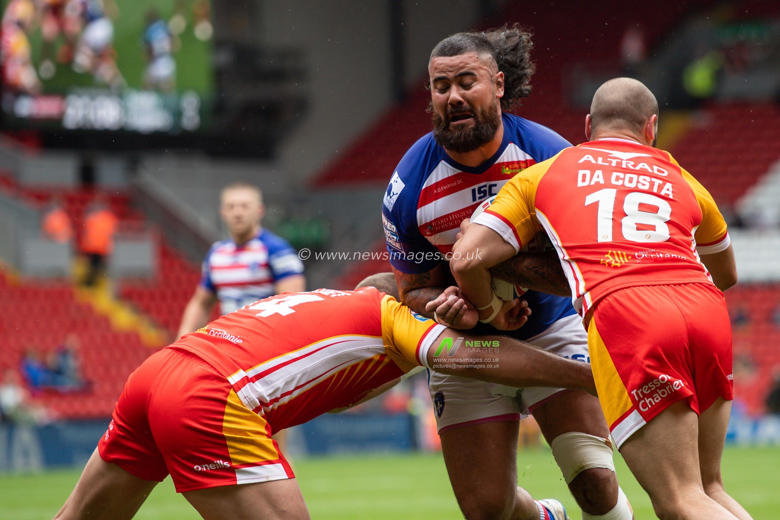 25th May 2019 , Anfield Stadium, Liverpool, England; Dacia Magic Weekend, Betfred Super League Round 16, Wakefield Trinity vs Catalans Dragons ; David Fifita (8) of Wakefield Trinity is tackled by Julian Bousquet (14) of Catalans Dragons 

Credit: Craig Thomas/News Images