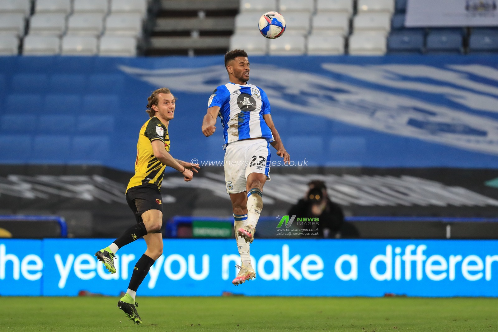Fraizer Campbell #22 of Huddersfield Town heads the high-ball