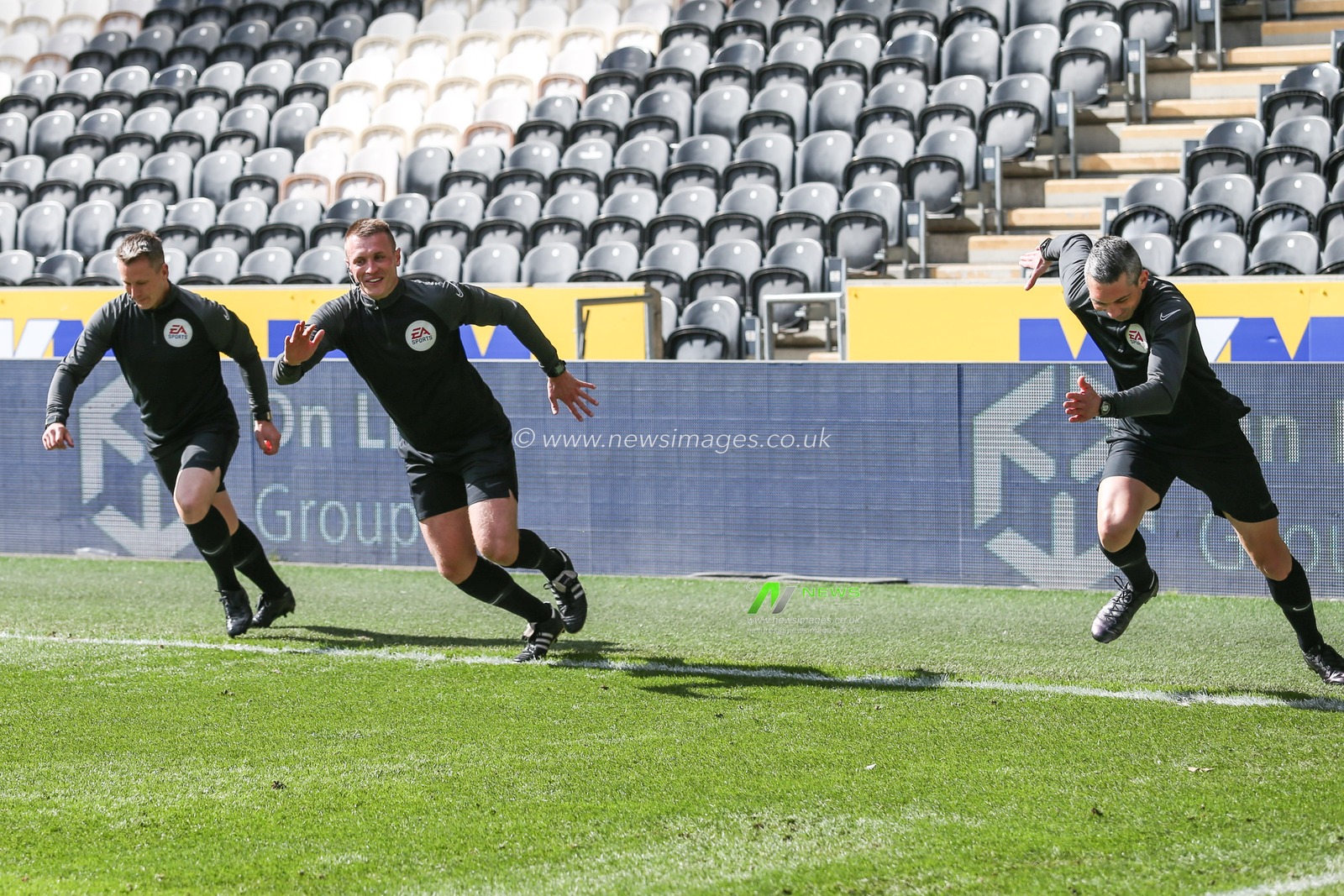 The three match officials Thomas Bramall, Matthew Parry and Hristo Karaivanov warming up prior to the match