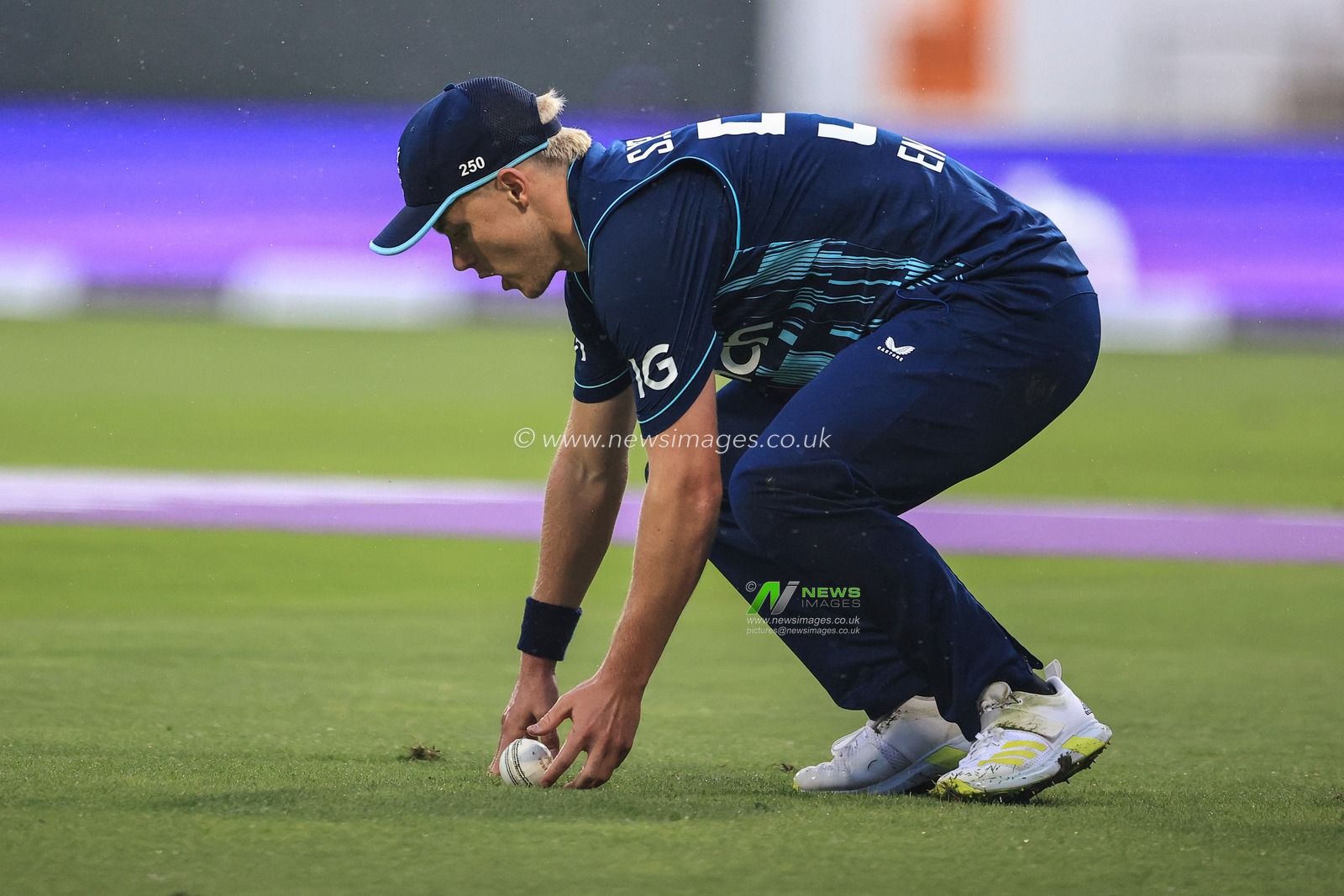 Sam Curran of England fields the ball