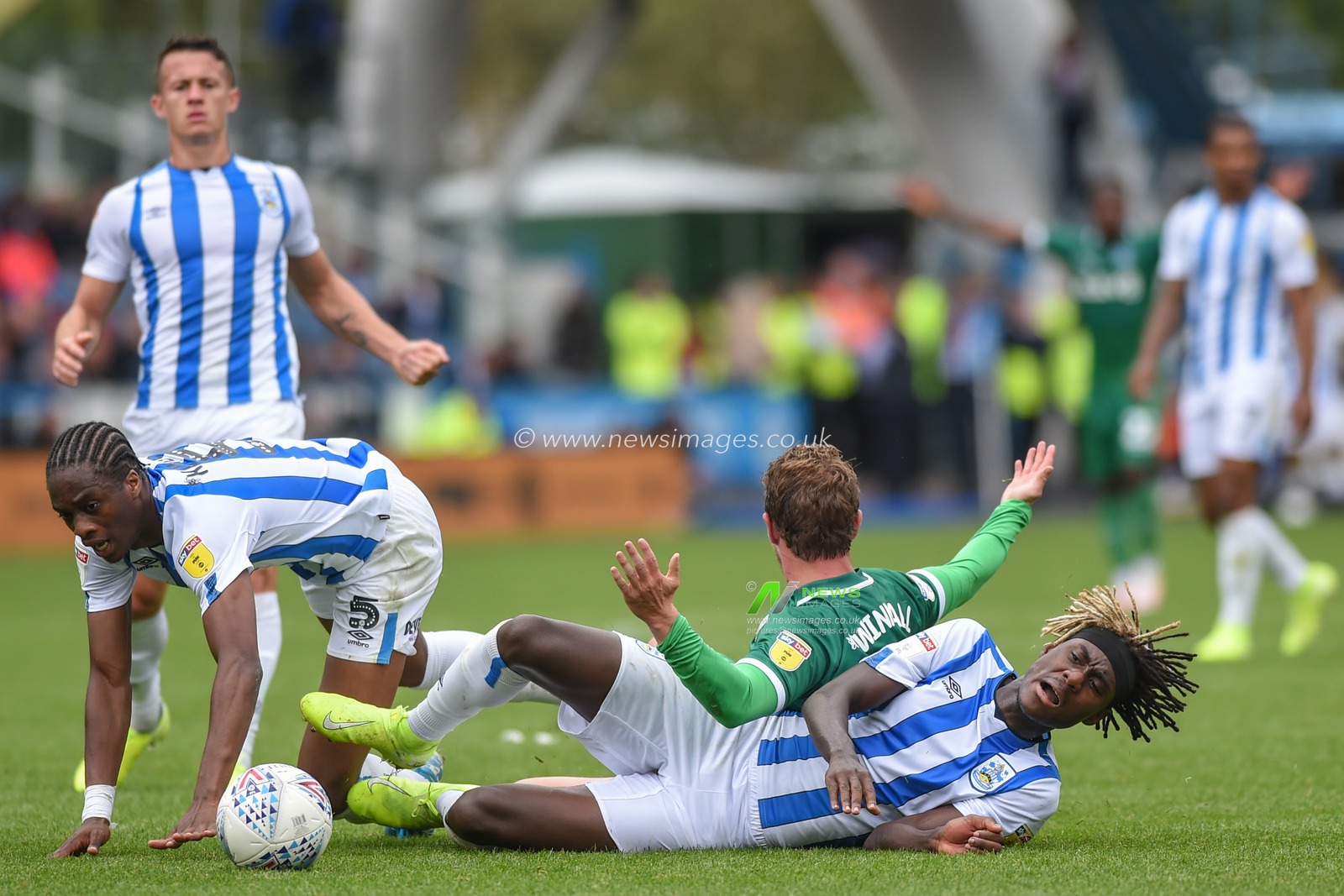 15th September 2019, John Smiths Stadium, Huddersfield England; Sky Bet Championship Football, Huddersfield Town vs Sheffield Wednesday ;Trevor Chalabah (8) of Huddersfield Town jumps into Sam Winnall (11) of Sheffield Wednesday as he fends off Terence Kongolo (5) of Huddersfield Town.

Credit: Dean Williams/News Images

English Football League images are subject to DataCo Licence