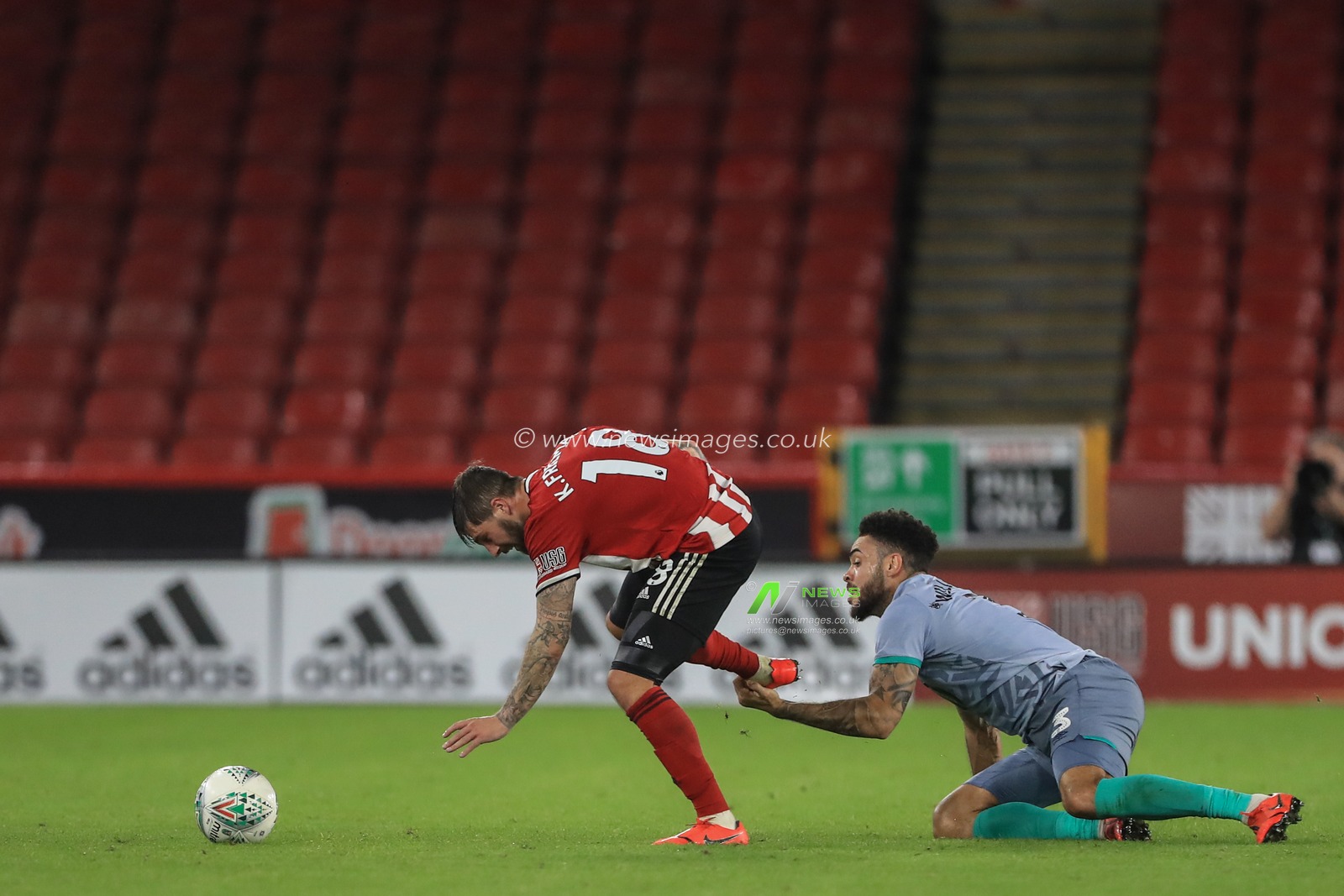 27th August 2019 , Bramall Lane, Sheffield, England; Carabao Cup Football, Second Round, Sheffield United vs Blackburn Rovers ; Kieron Freeman (18) of Sheffield United is fouled by Derrick Williams (3) of Blackburn Rovers 


Credit: Mark Cosgrove/News Images

English Football League images are subject to DataCo Licence