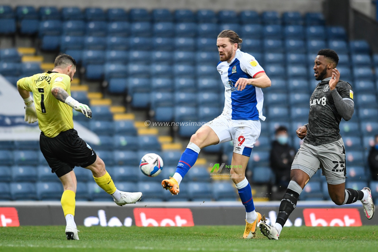 Keiren Westwood #1 of Sheffield Wednesday clears the ball  while under pressure from Sam Gallagher #9 of Blackburn Rovers
