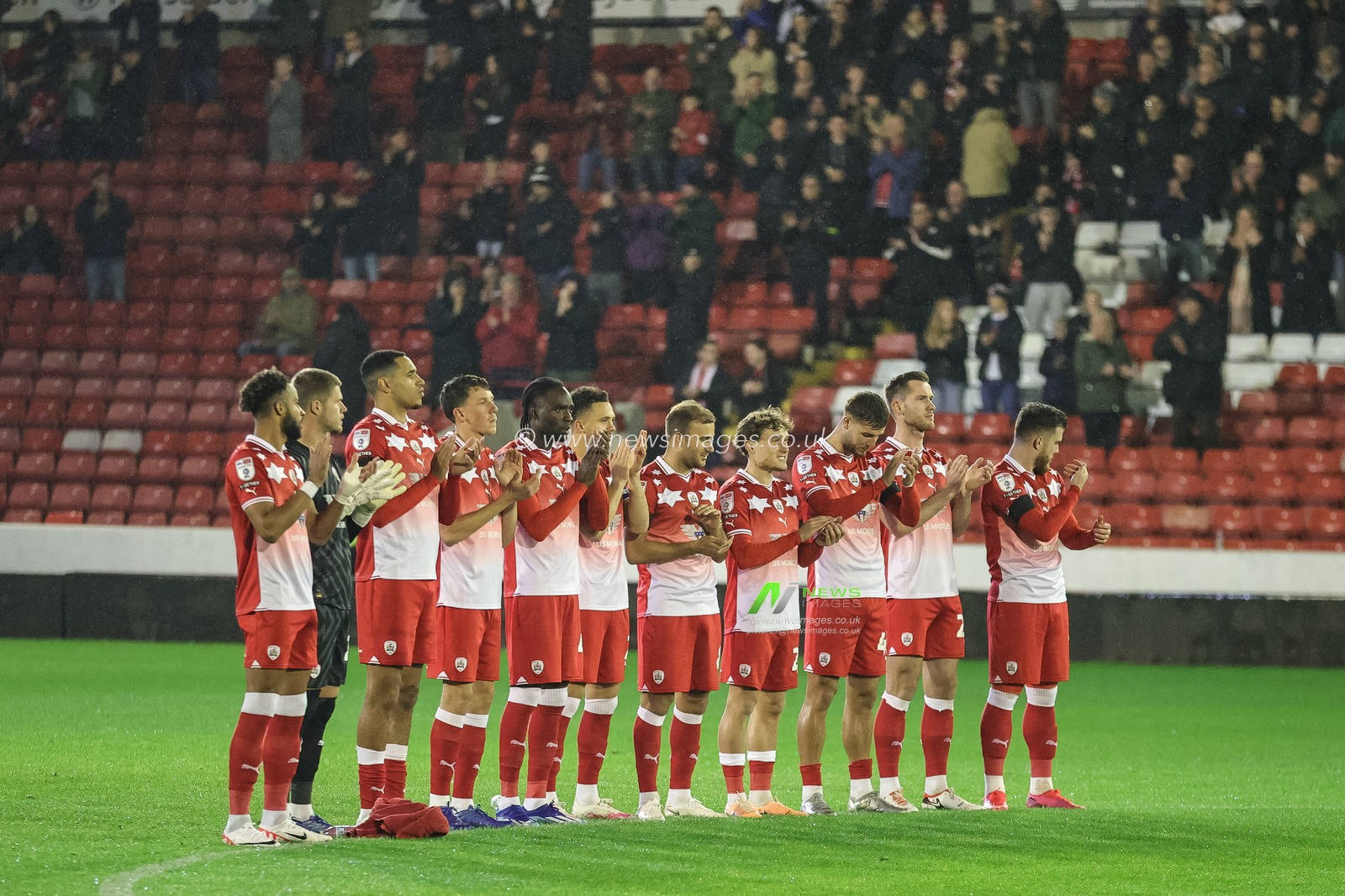 Players staff and fans hold a minutes applause during the Sky Bet League 1 match Barnsley vs Shrewsbury Town at Oakwell, Barnsley, United Kingdom, 24th October 2023

(Photo by Mark Cosgrove/News Images)
