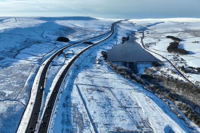 Heavy Snow over the hills of Scammonden Bridge and Booth Wood Reservoir areas of West Yorkshire and a free running M62 where the farm house sits in the middle of the motorway, Kirklees, United Kingdom, 11th January 2025

(Photo by Mark Cosgrove/News Images)
