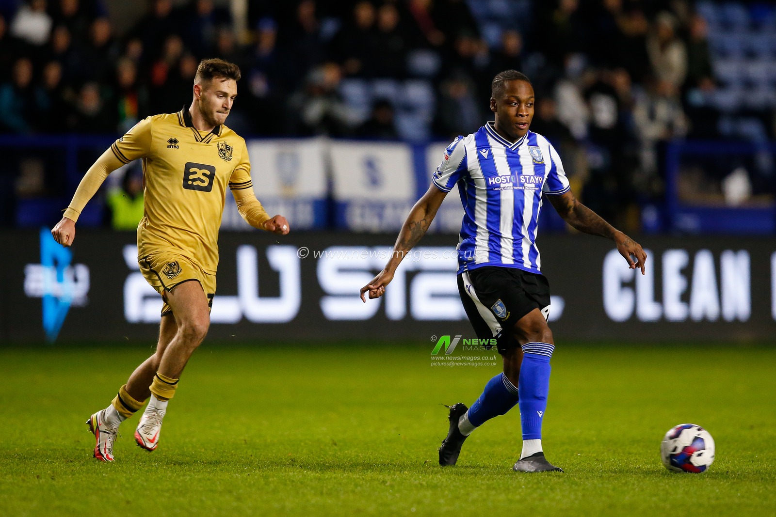 Dennis Adeniran #8 of Sheffield Wednesday and Dennis Politic #33 of Port Vale during the Sky Bet League 1 match Sheffield Wednesday vs Port Vale at Hillsborough, Sheffield, United Kingdom, 29th December 2022

(Photo by Ben Early/News Images)