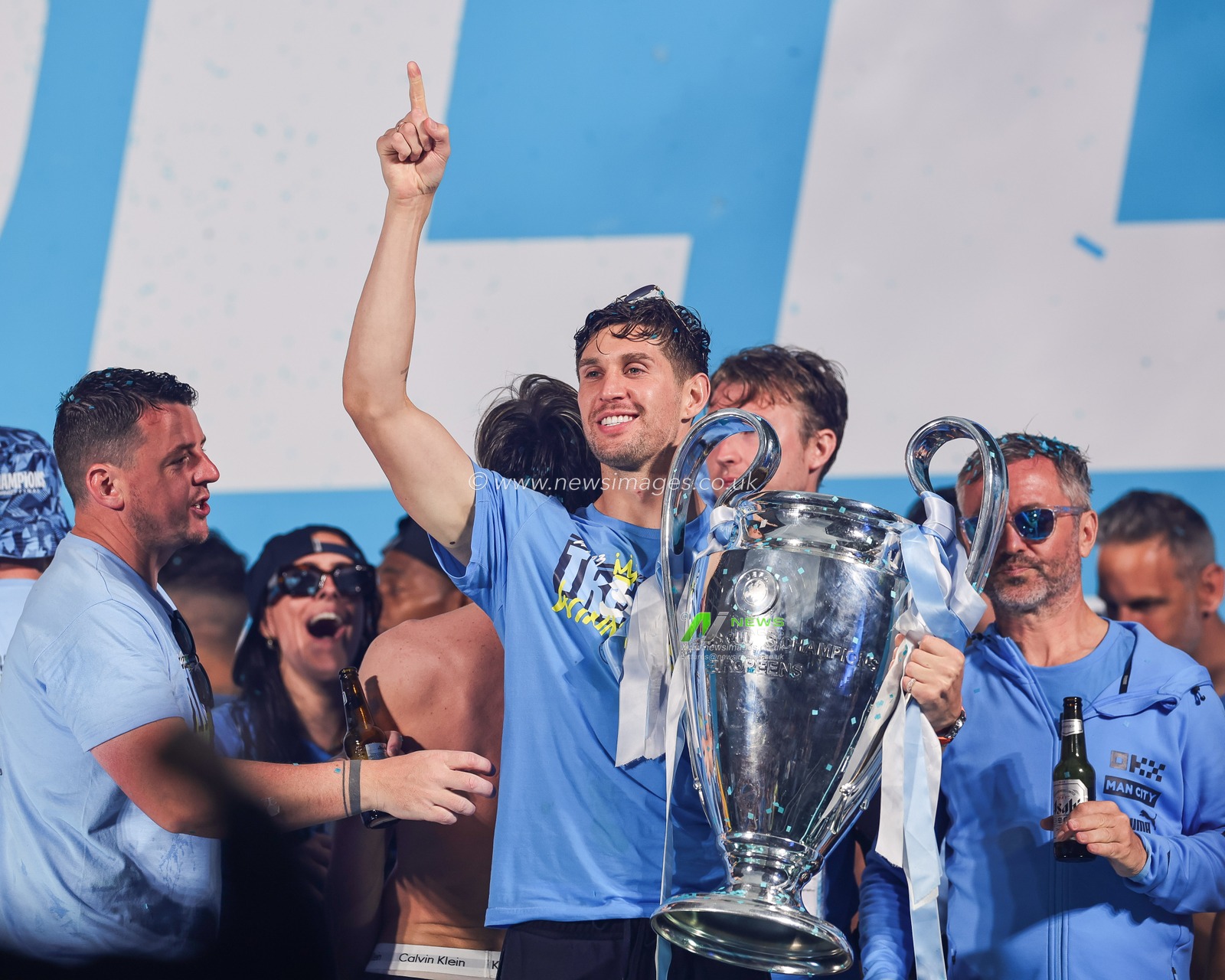 John Stones #5 of Manchester City  salutes the fans with the Champions league Trophy during Manchester City's Treble victory parade at St Peterâ€™s Square, Manchester, United Kingdom, 12th June 2023

(Photo by Mark Cosgrove/News Images)