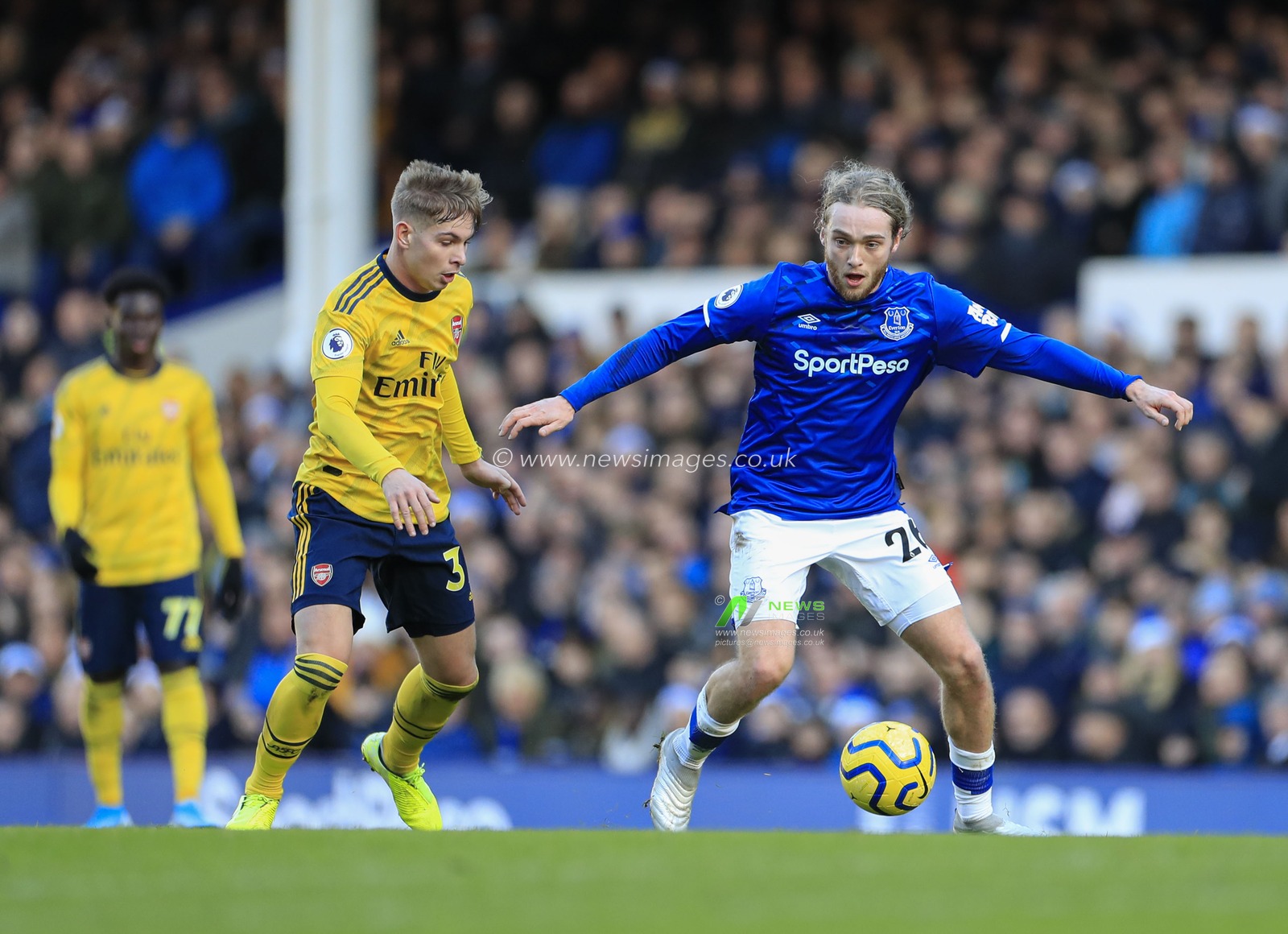 21st December 2019, Goodison Park, Liverpool, England; Premier League, Everton v Arsenal : Tom Davies (26) of Everton controls the ball under pressure from Emile Smith Rowe (32) of Arsenal

Credit: Conor Molloy/News Images