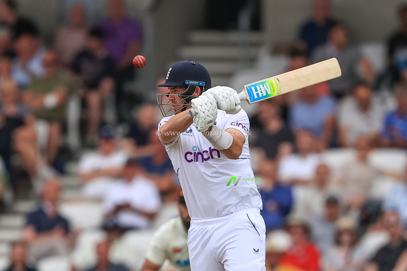 Jamie Overton of England hits yet another boundary, four