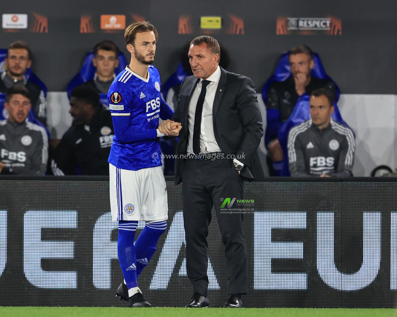 James Maddison #10 of Leicester City shakes hands with Brendan Rogers manager of Leicester City before heâ€™s substituted on