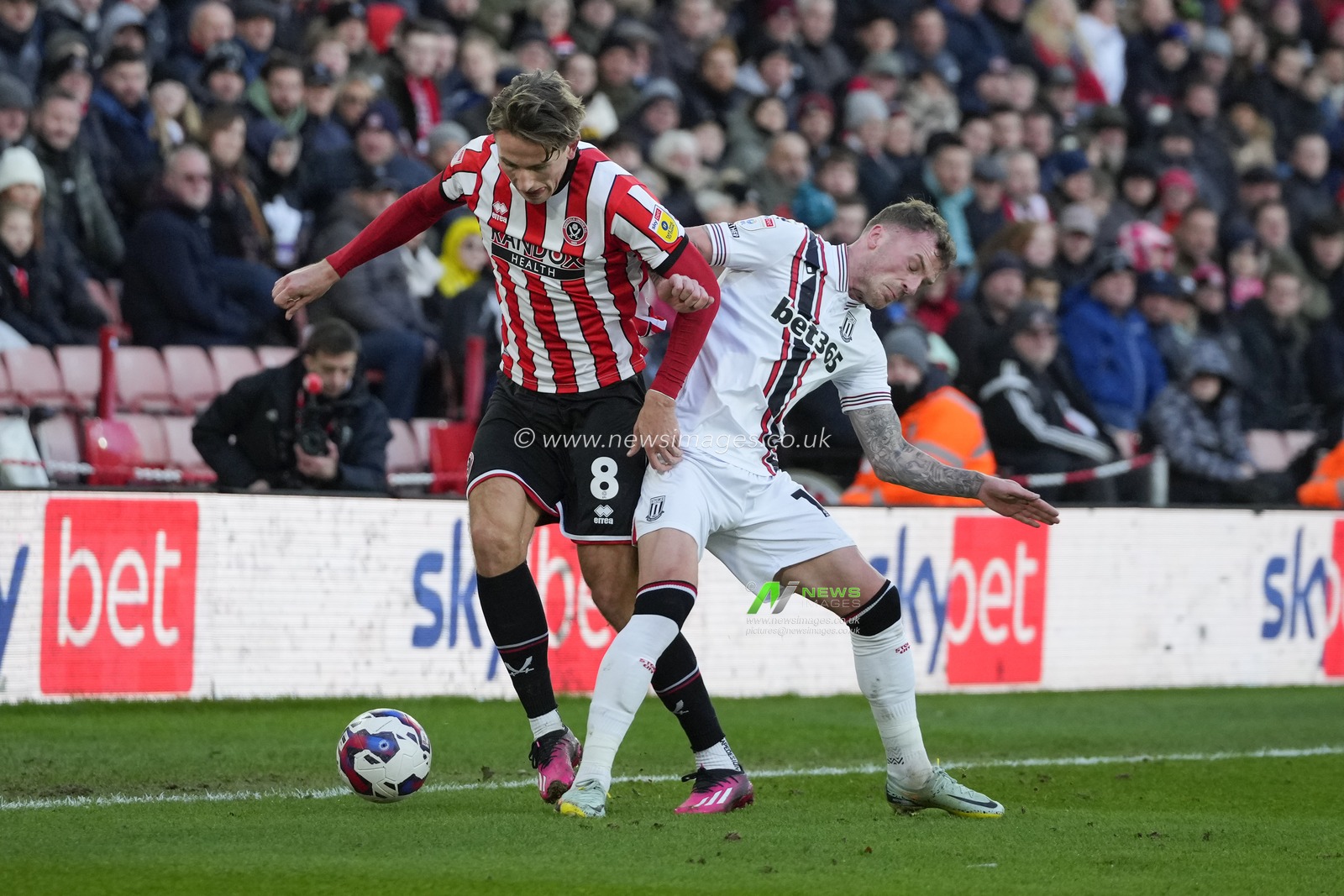 Josh Tymon #14 of Stoke City competes for the ball with Sander Berge #8 of Sheffield United during the Sky Bet Championship match Sheffield United vs Stoke City at Bramall Lane, Sheffield, United Kingdom, 14th January 2023

(Photo by Steve Flynn/News Images)