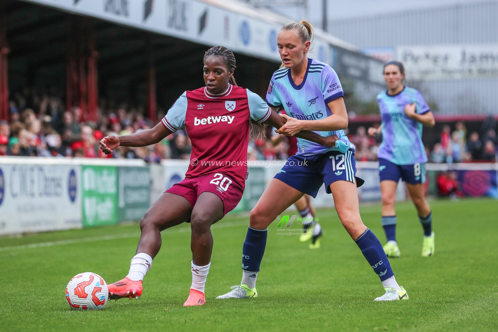 Viviane Asseyi of West Ham United is put under pressure by Frida Maanum of Arsenal during the Barclays Women's Super League match West Ham United Women vs Arsenal Women at Chigwell Construction Stadium, Dagenham, United Kingdom, 20th October 2024

(Photo by Izzy Poles/News Images)