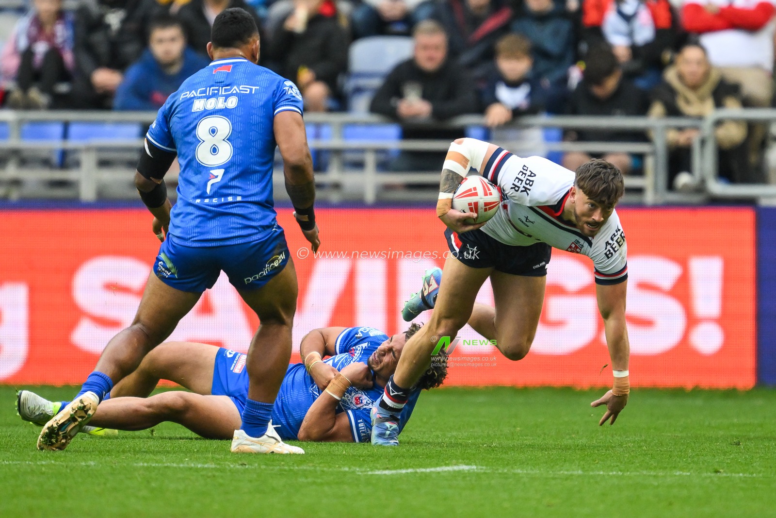 Matty Ashton of England breaks the tackle by Izack Tago of Samoa during the ABK Beer Internationals Series match England vs Samoa at The Brick Community Stadium, Wigan, United Kingdom, 27th October 2024

(Photo by Craig Thomas/News Images)