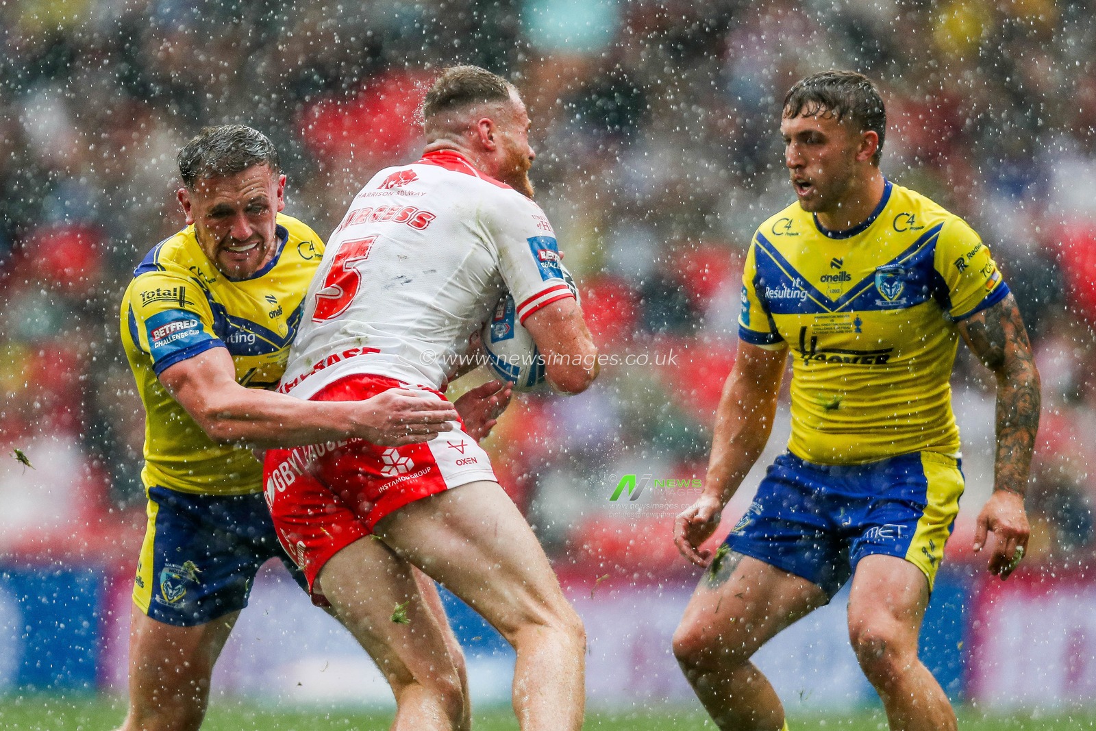 Ben Currie of Warrington Wolves makes a tackle during the Betfred Challenge Cup Final Warrington Wolves vs Hull KR at Wembley Stadium, London, United Kingdom, 7th June 2025

(Photo by Izzy Poles/News Images)