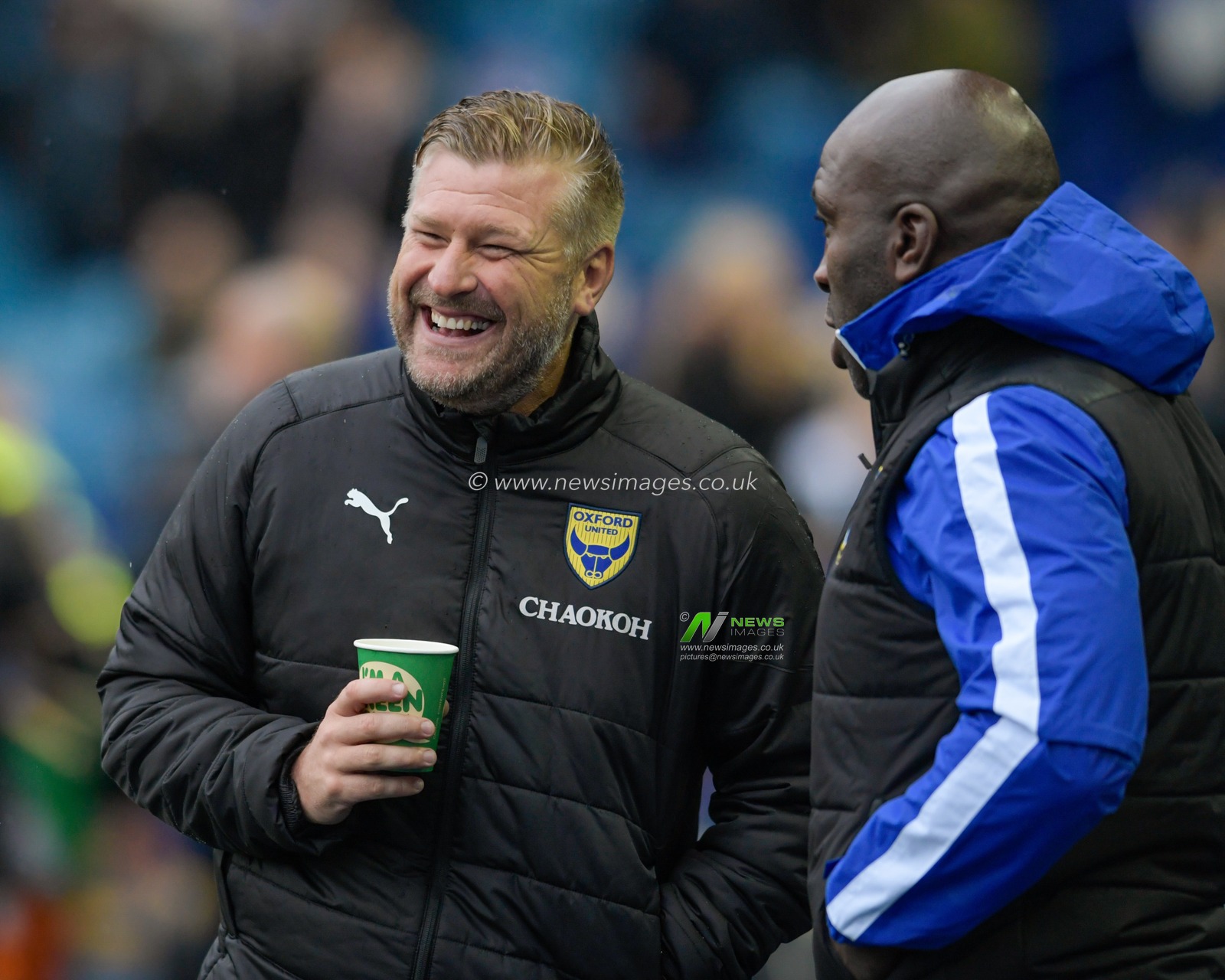 Karl Robinson manager of Oxford United and Darren Moore manager of Sheffield Wednesday smile before the game