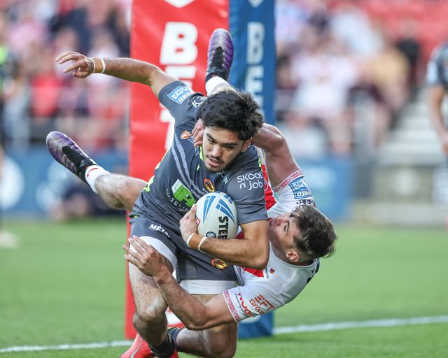 Jack Welsby of St. Helens tackles Guillermo Aispuro-Bichet of Catalan Dragons behind his own goal line for a re-set during the Betfred Super League Round 11 match St Helens vs Catalans Dragons at Totally Wicked Stadium, St Helens, United Kingdom, 15th May 2025

(Photo by Mark Cosgrove/News Images)