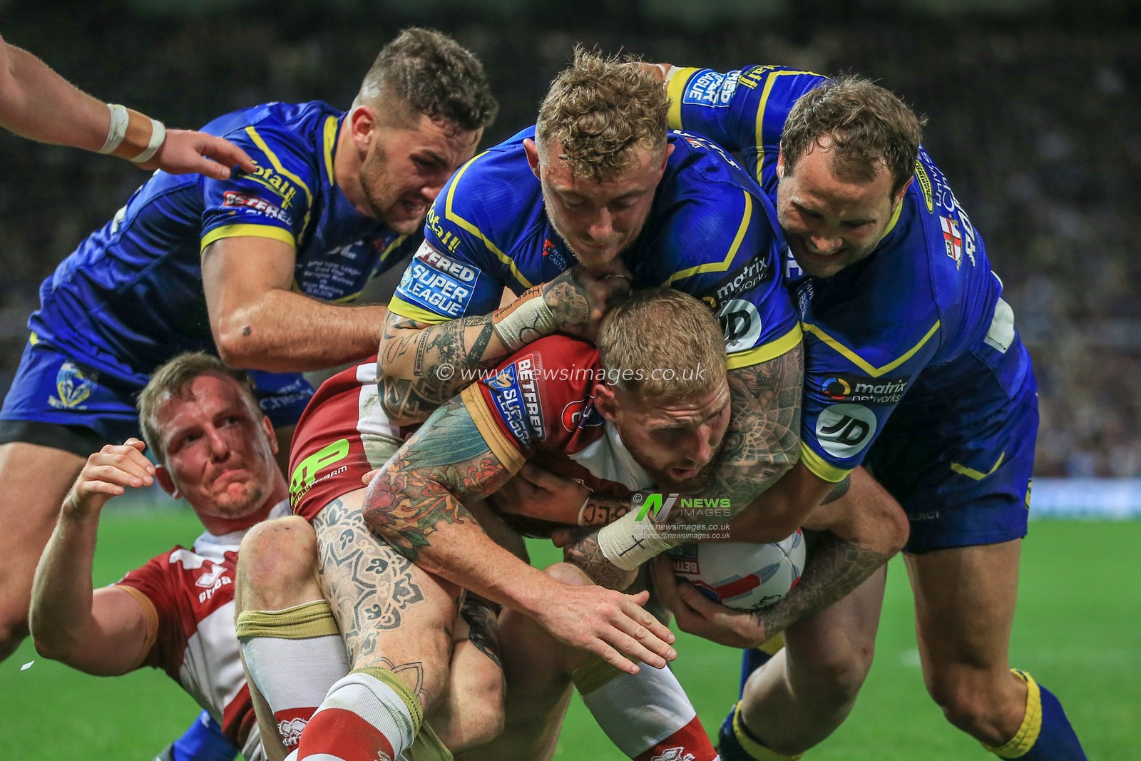 13th October 2018 , Old Trafford,  Manchester, England;  Betfred Super League Grand Final, Wigan Warriors v Warrington Wolves; Sam Tomkins of Wigan Warriors is tackled by Josh Charnley of Warrington Wolves 

Mark Cosgrove/News Images