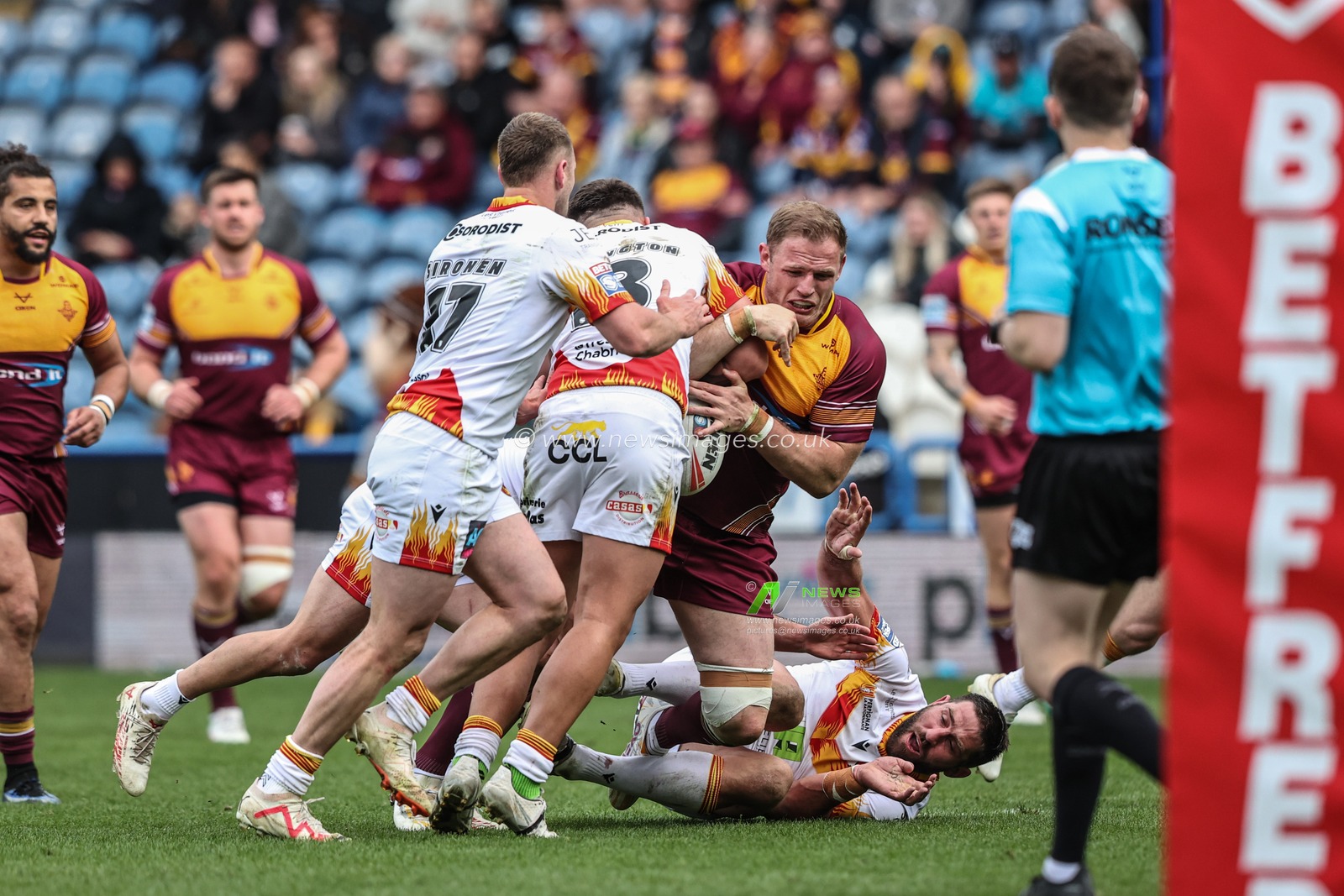 Tom Burgess of Huddersfield Giants is tackled by Oliver Partingon of Catalan Dragons during the Betfred Super League match Huddersfield Giants vs Catalans Dragons at John Smith's Stadium, Huddersfield, United Kingdom, 13th April 2025

(Photo by Alfie Cosgrove/News Images)