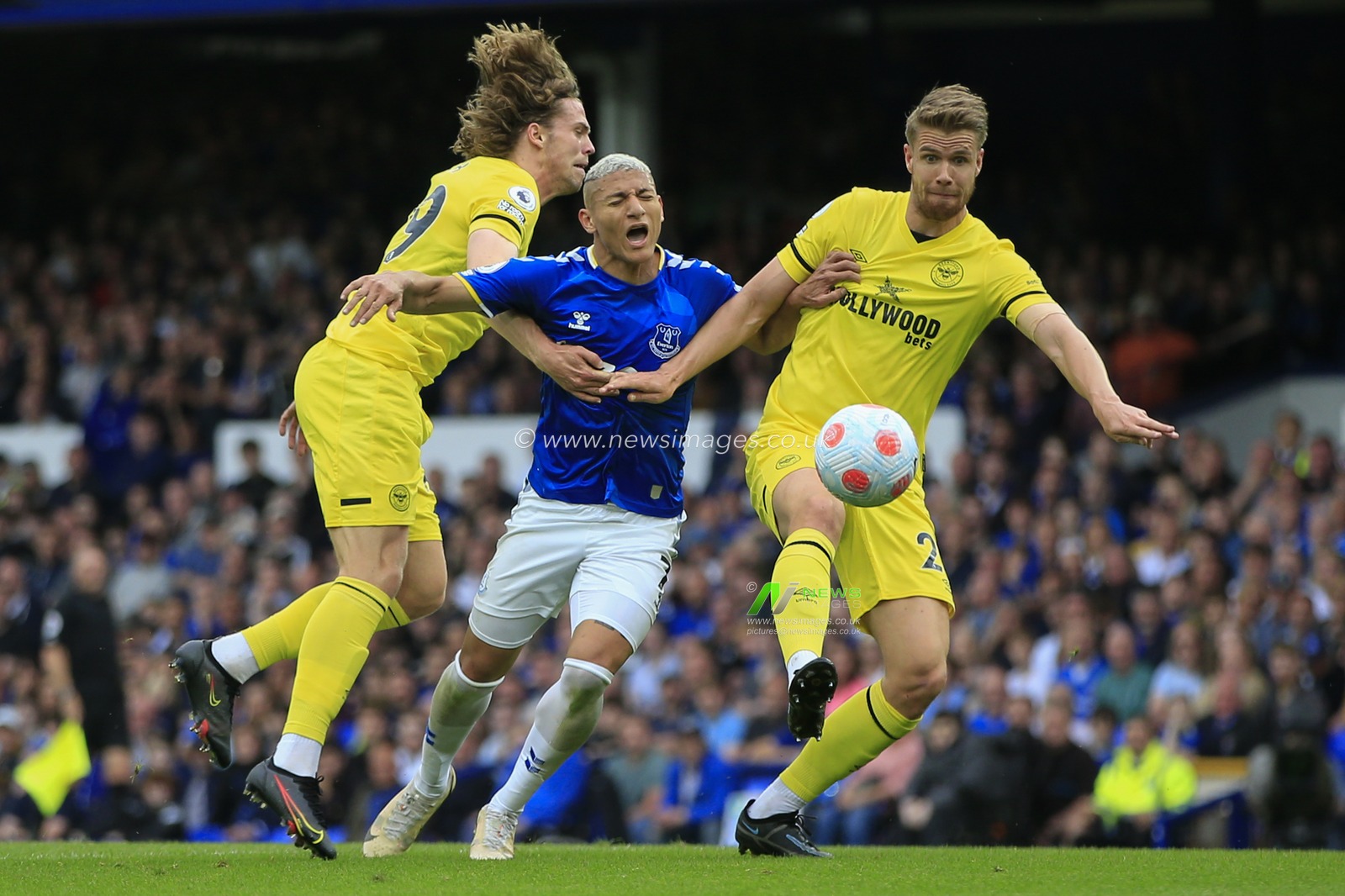 A foul on Richarlison #7 of Everton by Mads Bech Sorensen #29 of Brentford and Kristoffer Ajer #20 of Brentford