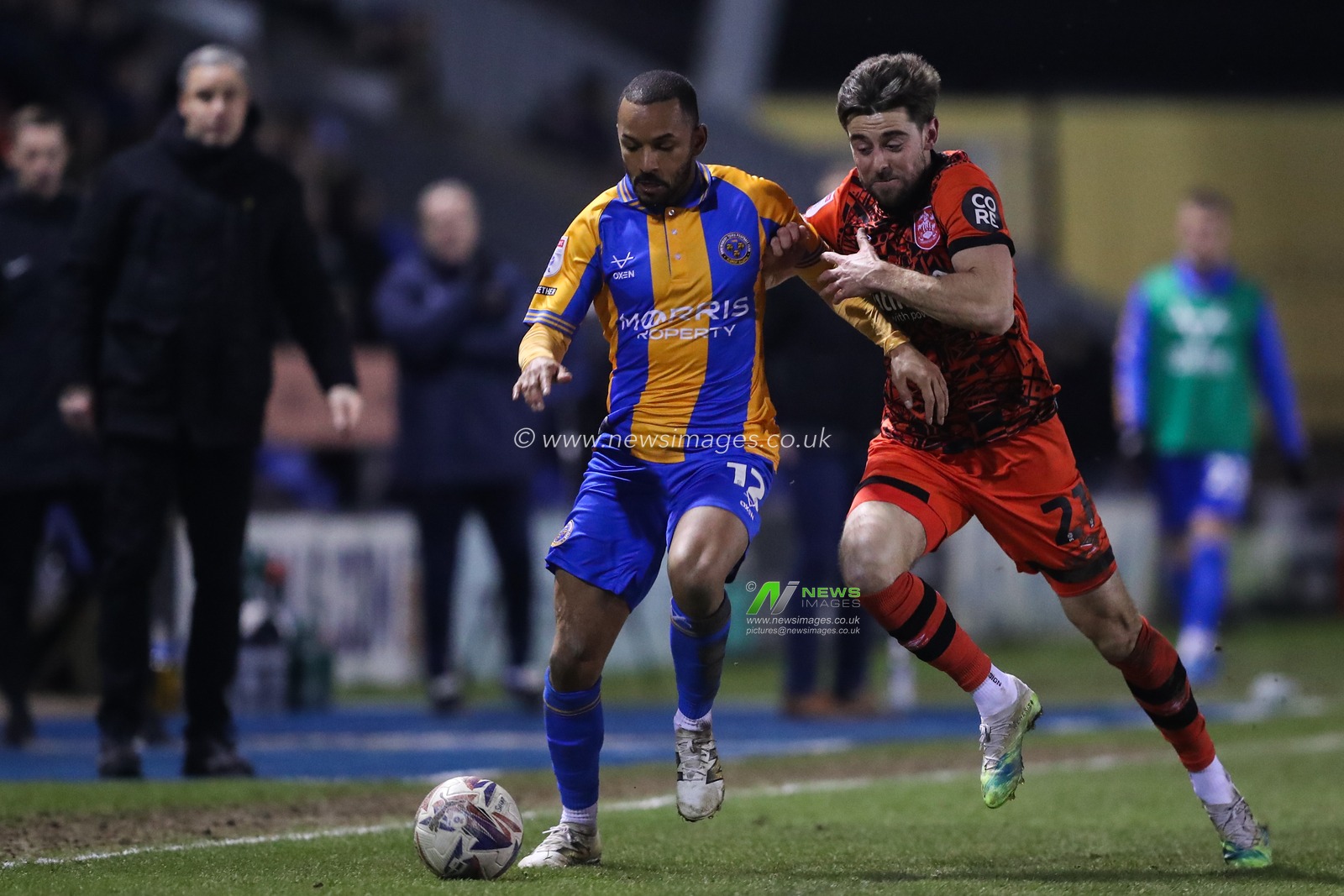 Funso Ojo of Shrewsbury Town holds off Antony Evans of Huddersfield Town during the Sky Bet League 1 match Shrewsbury Town vs Huddersfield Town at Croud Meadow, Shrewsbury, United Kingdom, 18th February 2025

(Photo by Gareth Evans/News Images)