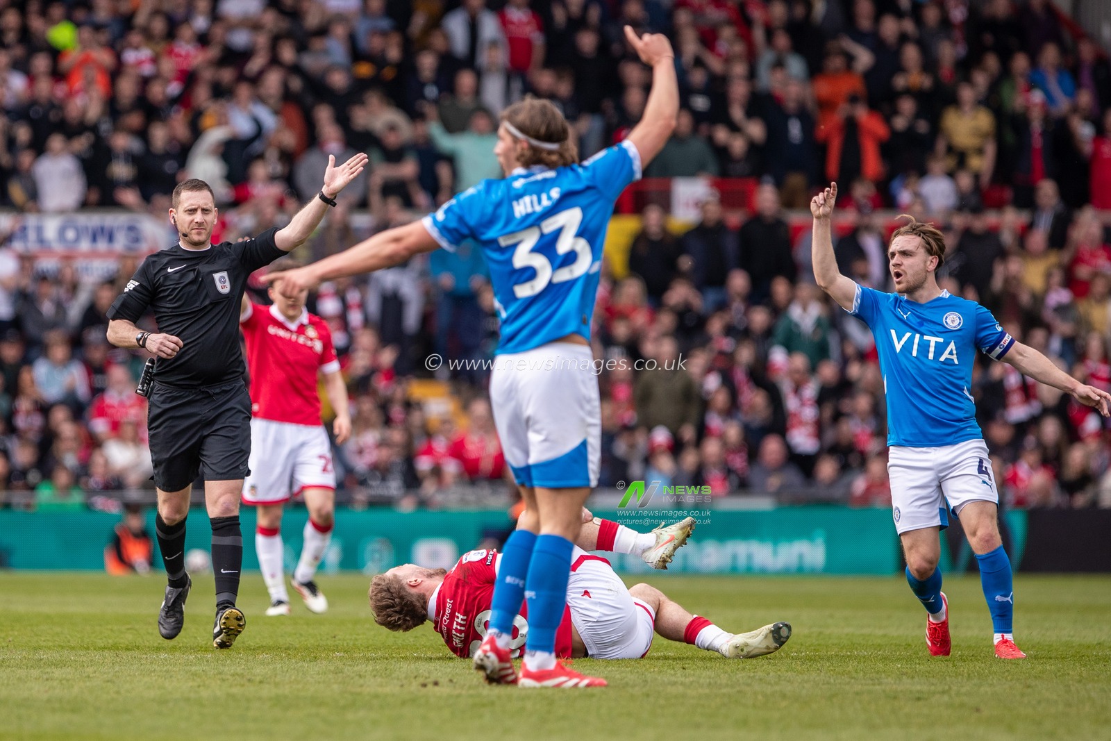 Referee Simon Mather awards a free kick during the Sky Bet League 1 match Wrexham vs Stockport County at SToK Cae Ras, Wrexham, United Kingdom, 22nd March 2025

(Photo by Nik Mesney/News Images)