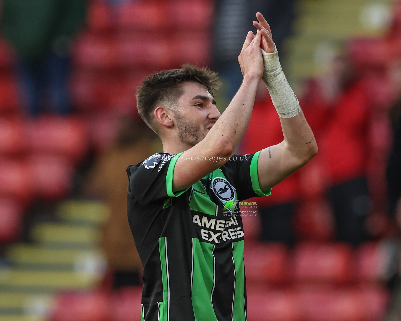 Billy Gilmour of Brighton & Hove Albion applauds the travelling fans after the game during the Premier League match Sheffield United vs Brighton and Hove Albion at Bramall Lane, Sheffield, United Kingdom, 18th February 2024

(Photo by Mark Cosgrove/News Images)