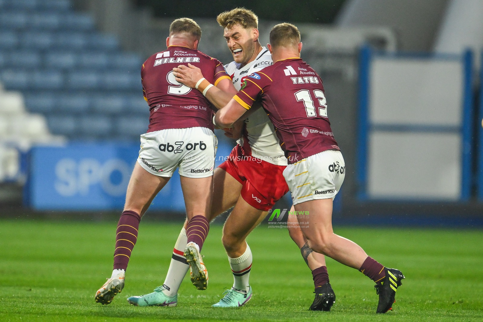 Jack Ormondroyd of Salford Red Devils is tackled by Adam Milner of Huddersfield Giants and Luke Yates of Huddersfield Giants during the Betfred Super League Round 10 match Huddersfield Giants vs Salford Red Devils at John Smith's Stadium, Huddersfield, United Kingdom, 3rd May 2024

(Photo by Craig Thomas/News Images)