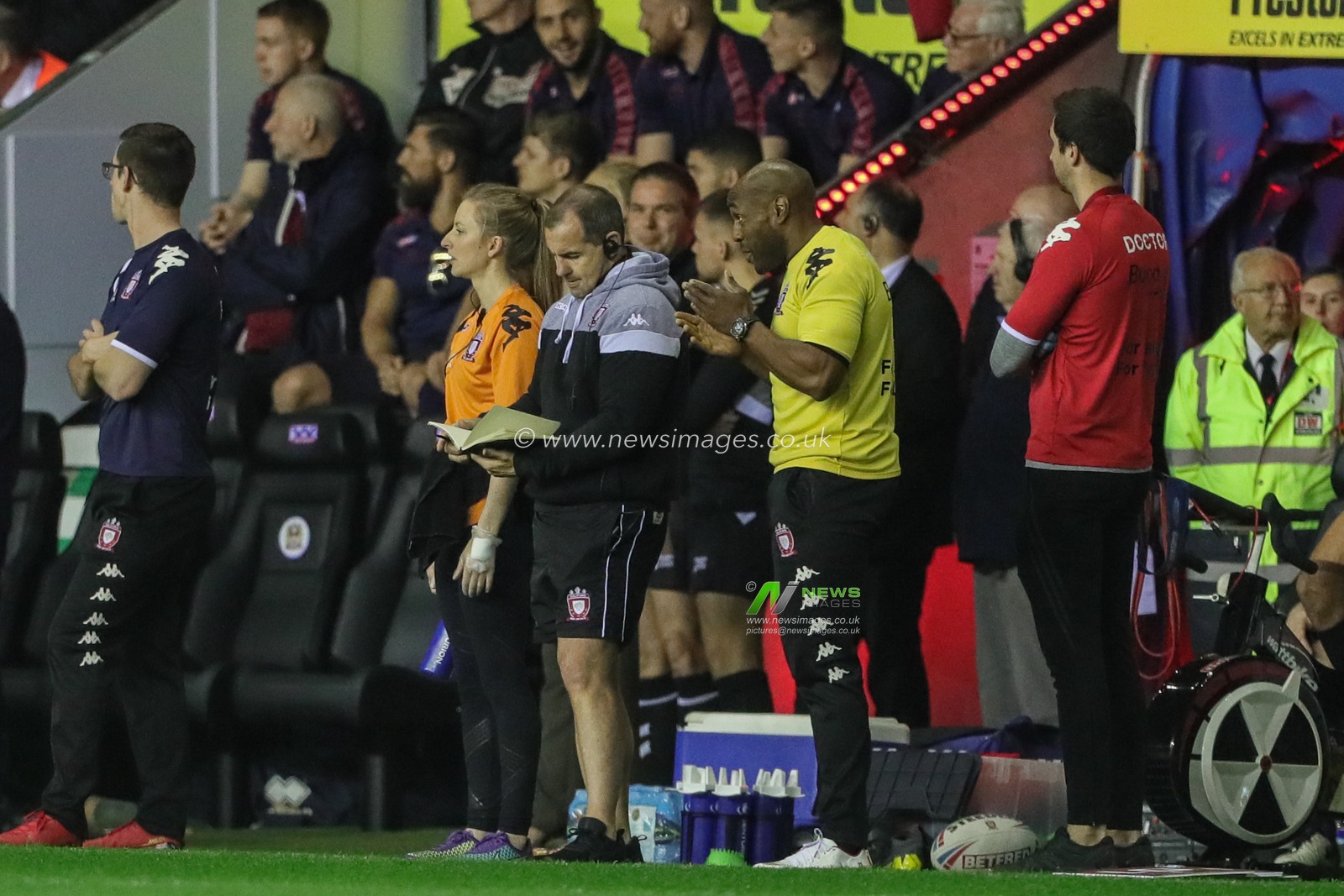 20th September 2019 , DW Stadium, Wigan, England;  Betfred Super League, Round Playoffs, Wigan Warriors vs Salford Red Devils ; Ian Watson head coach of Salford Red Devils check his tactics book during the game 

Credit: Mark Cosgrove/News Images