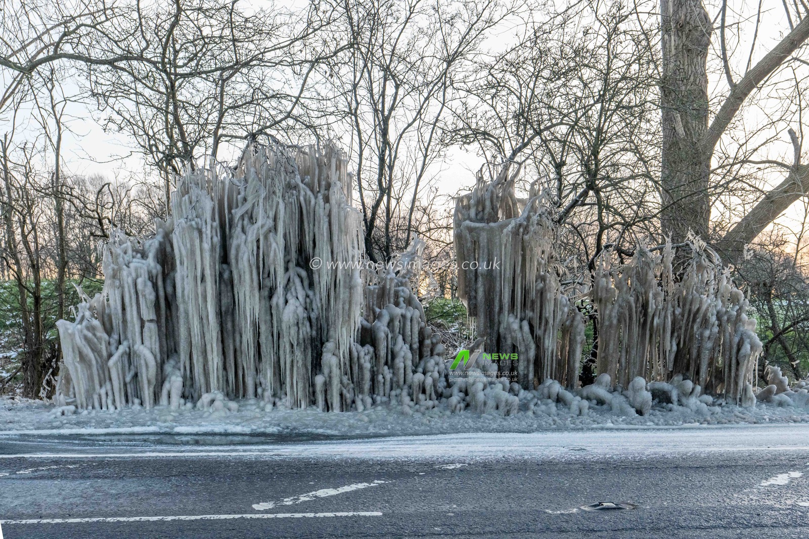 Sub zero conditions in Hertfordshire with side road water has formed these ice formations on the busy A1081 South Mimms road
