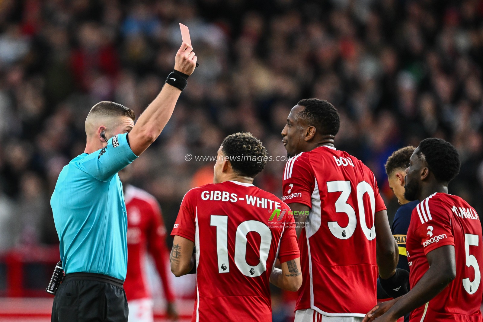 Referee Robert Jones gives a red card to Willy Boly of Nottingham Forest during the Premier League match Nottingham Forest vs Bournemouth at City Ground, Nottingham, United Kingdom, 23rd December 2023

(Photo by Craig Thomas/News Images)