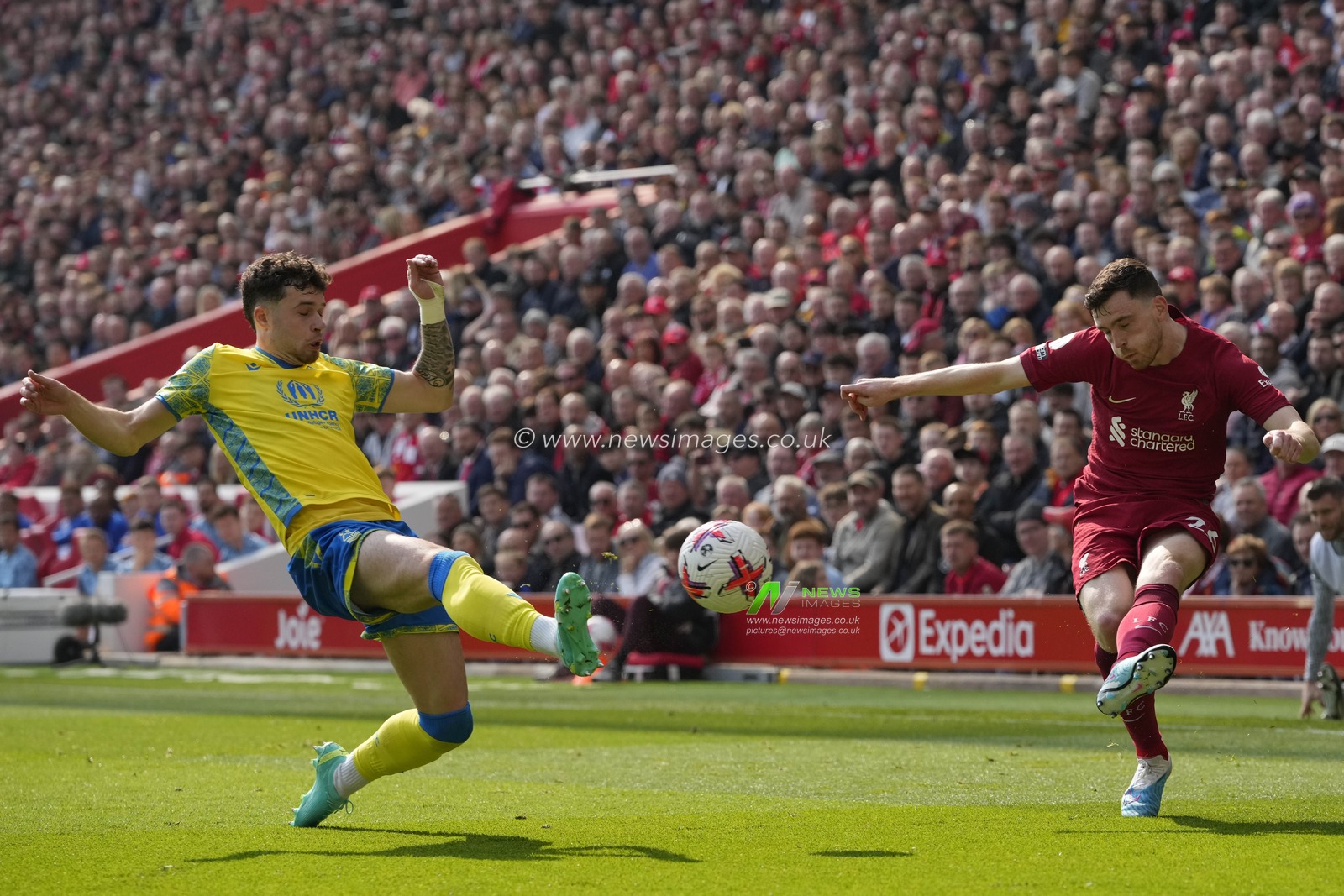 Neco Williams #7 of Nottingham Forest stretches to block a cross from Andrew Robertson #26 of Liverpool during the Premier League match Liverpool vs Nottingham Forest at Anfield, Liverpool, United Kingdom, 22nd April 2023

(Photo by Steve Flynn/News Images)