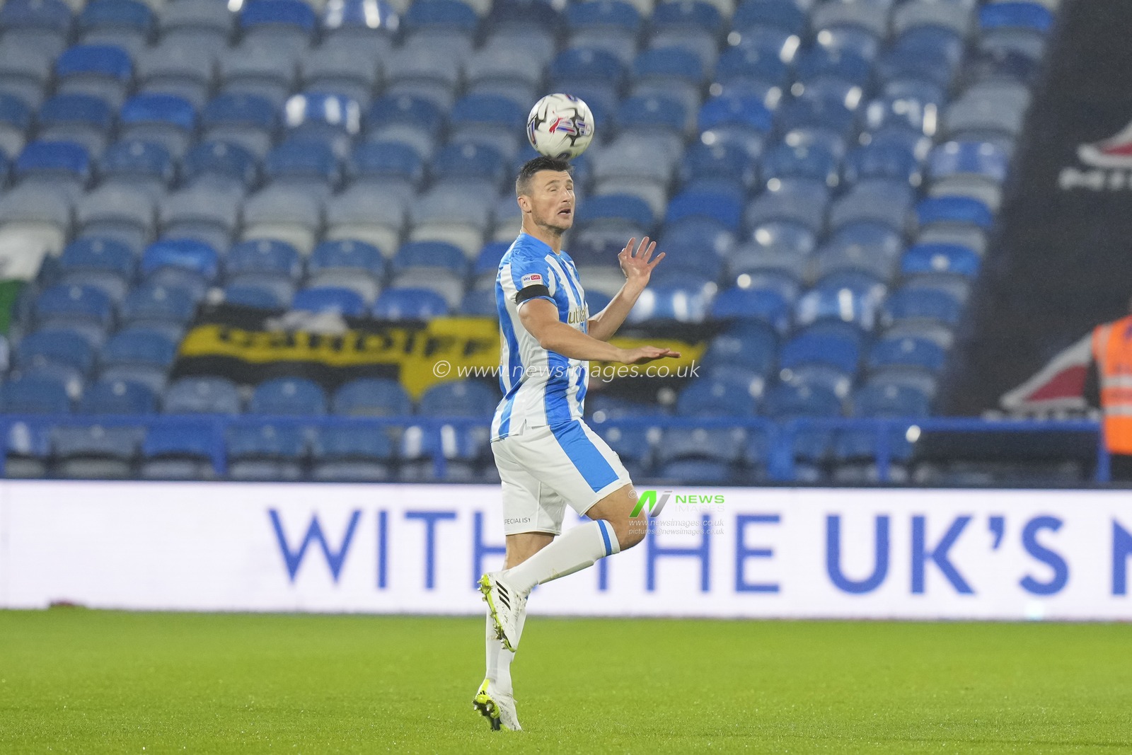 Matty Pearson #4 of Huddersfield Town heads clear during the Sky Bet Championship match Huddersfield Town vs Cardiff City at John Smith's Stadium, Huddersfield, United Kingdom, 24th October 2023

(Photo by Steve Flynn/News Images)
