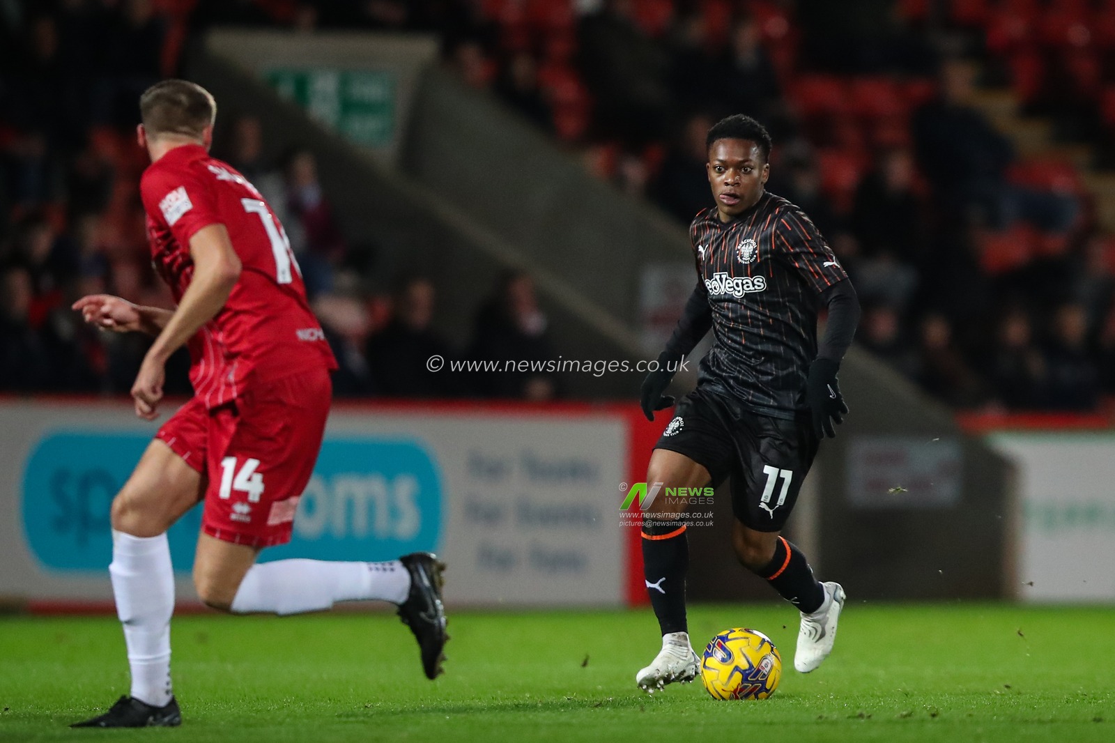 Karamoko Dembele of Blackpool breaks with the ball during the Sky Bet League 1 match Cheltenham Town vs Blackpool at The Completely-Suzuki Stadium, Cheltenham, United Kingdom, 13th February 2024

(Photo by Gareth Evans/News Images)