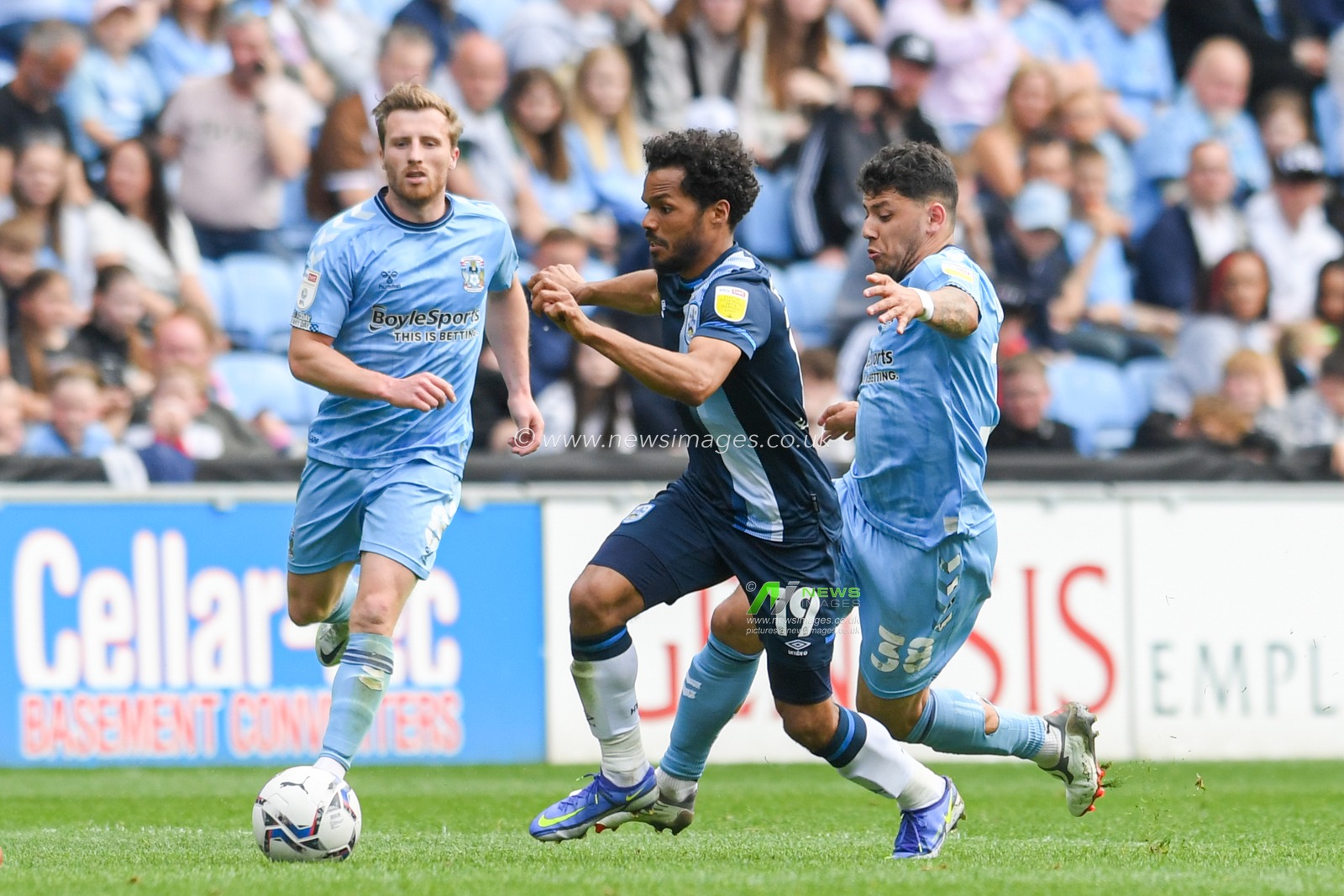 Duane Holmes #19 of Huddersfield Town starts an attacking move
