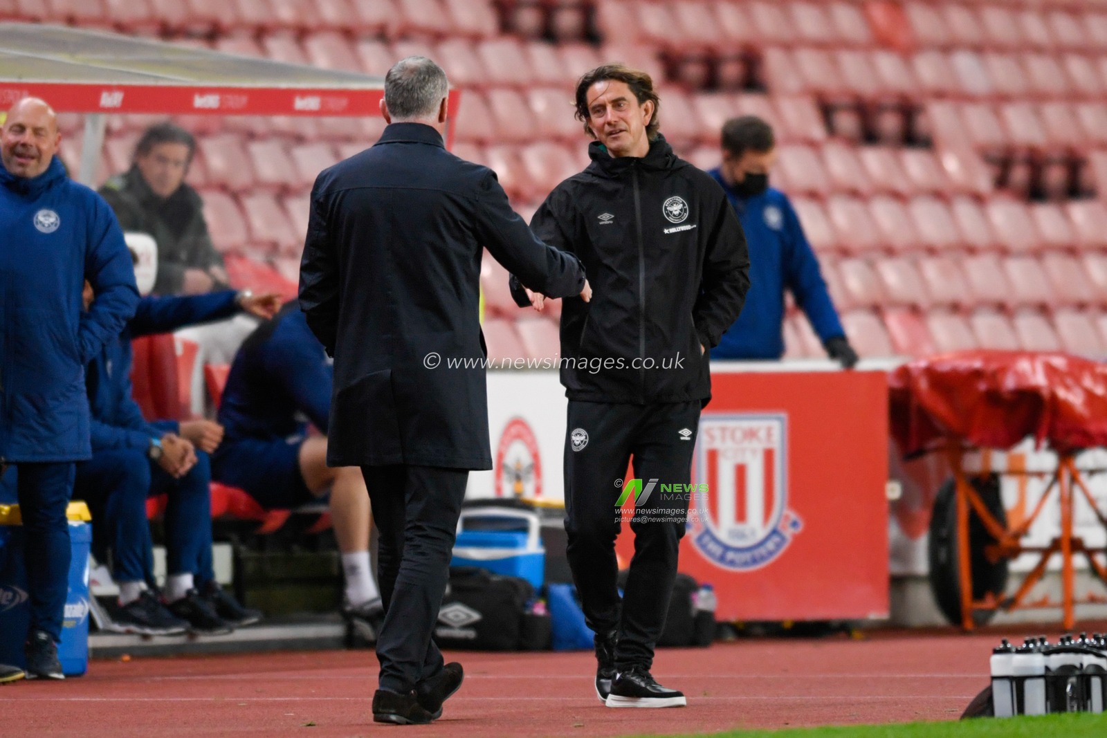 Thomas Frank manager of Brentford shakes the hand of Michael O'Neill manager of Stoke City before the game