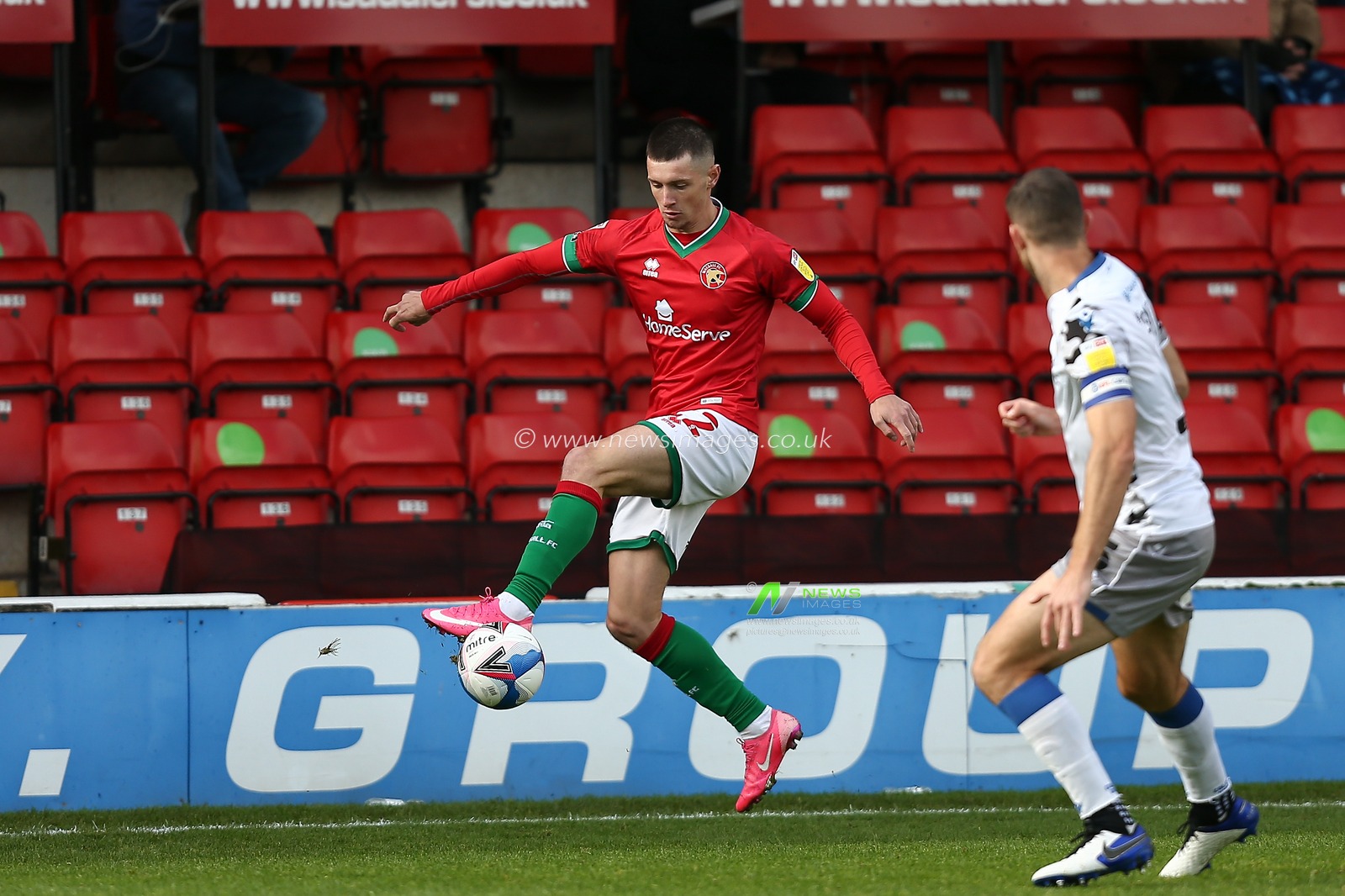 Rory Holden (22) of Walsall  controls the ball