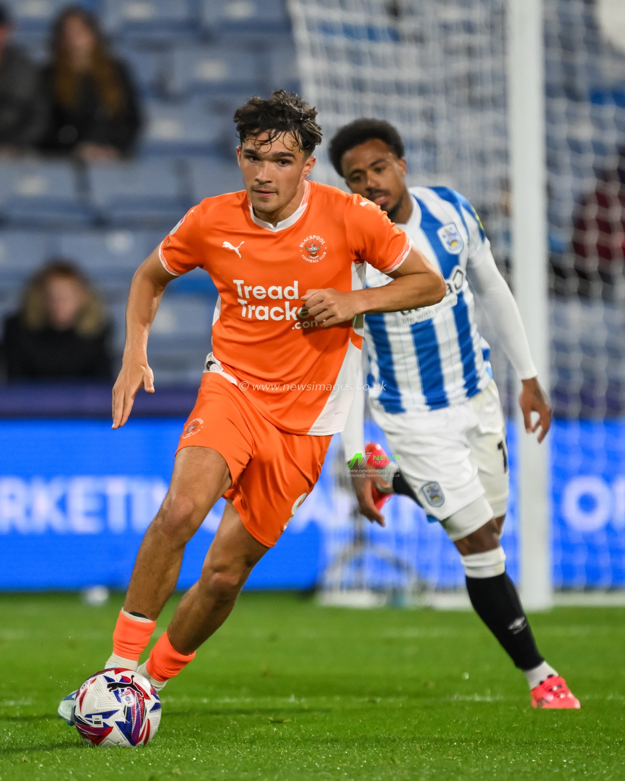 Kyle Joseph of Blackpool makes a break with the ball  during the Sky Bet League 1 match Huddersfield Town vs Blackpool at John Smith's Stadium, Huddersfield, United Kingdom, 24th September 2024

(Photo by Craig Thomas/News Images)