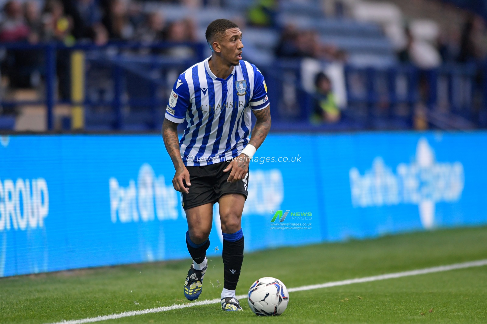 Liam Palmer #2 of Sheffield Wednesday looks for a passing option