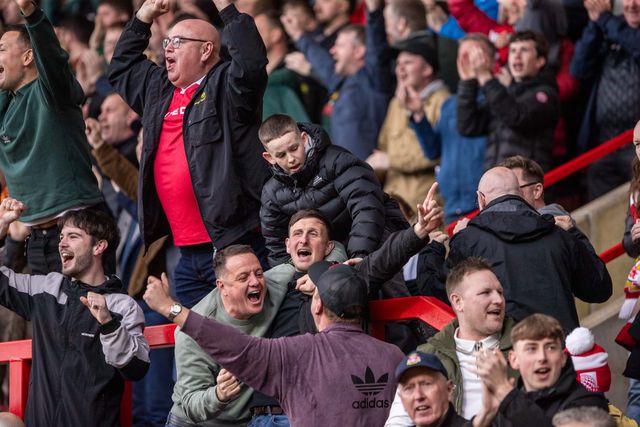 Wrexham fans celebrate their victory folowing the Sky Bet League 1 match Wrexham vs Stockport County at SToK Cae Ras, Wrexham, United Kingdom, 22nd March 2025

(Photo by Nik Mesney/News Images)